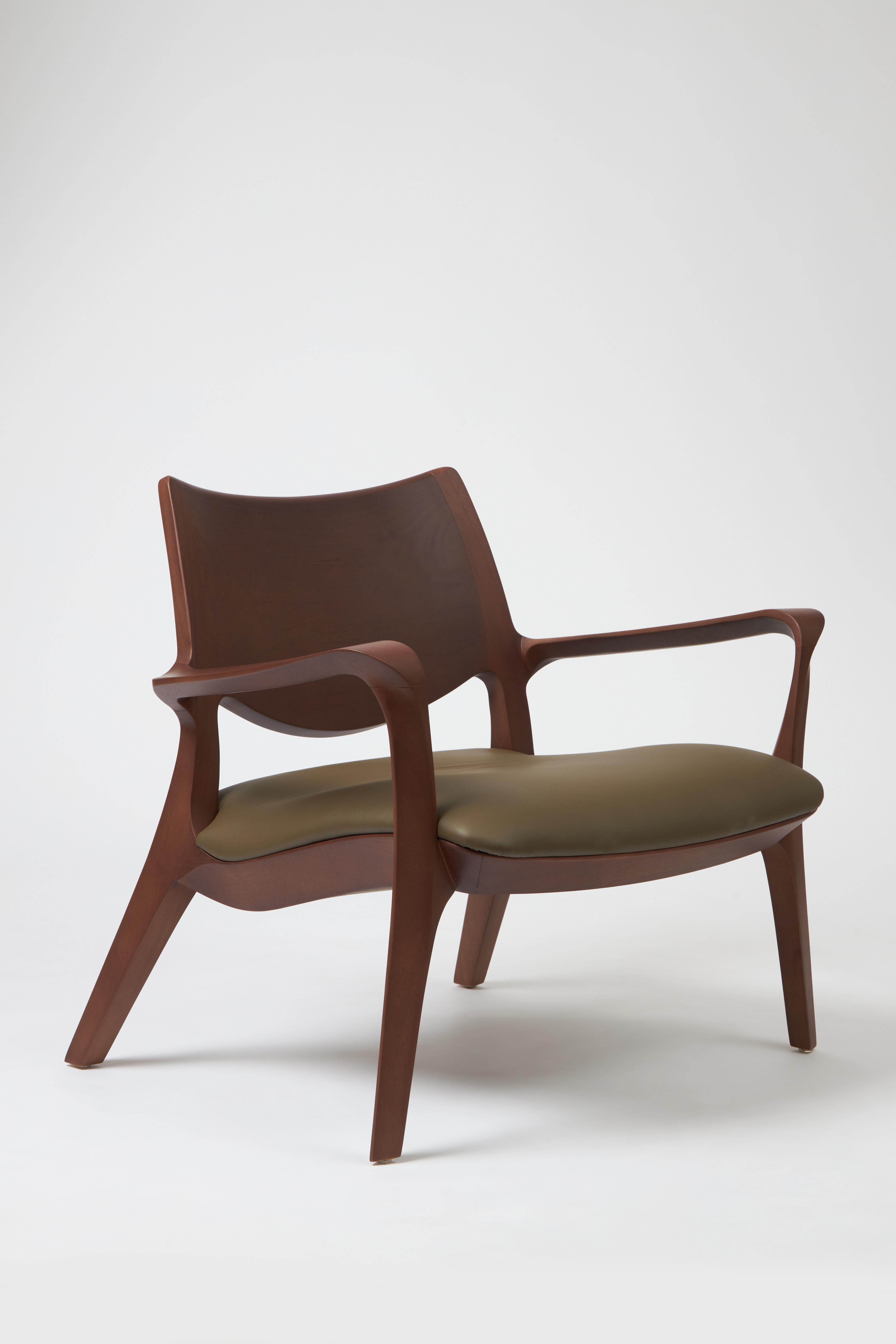 Contemporary Modern Style Aurora armchair Sculpted in solid wood, leather seat and back For Sale