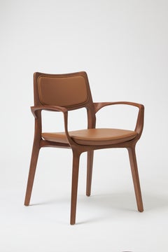Modern Style Aurora Chair Sculpted in Walnut Finish Arms, leather back & seating