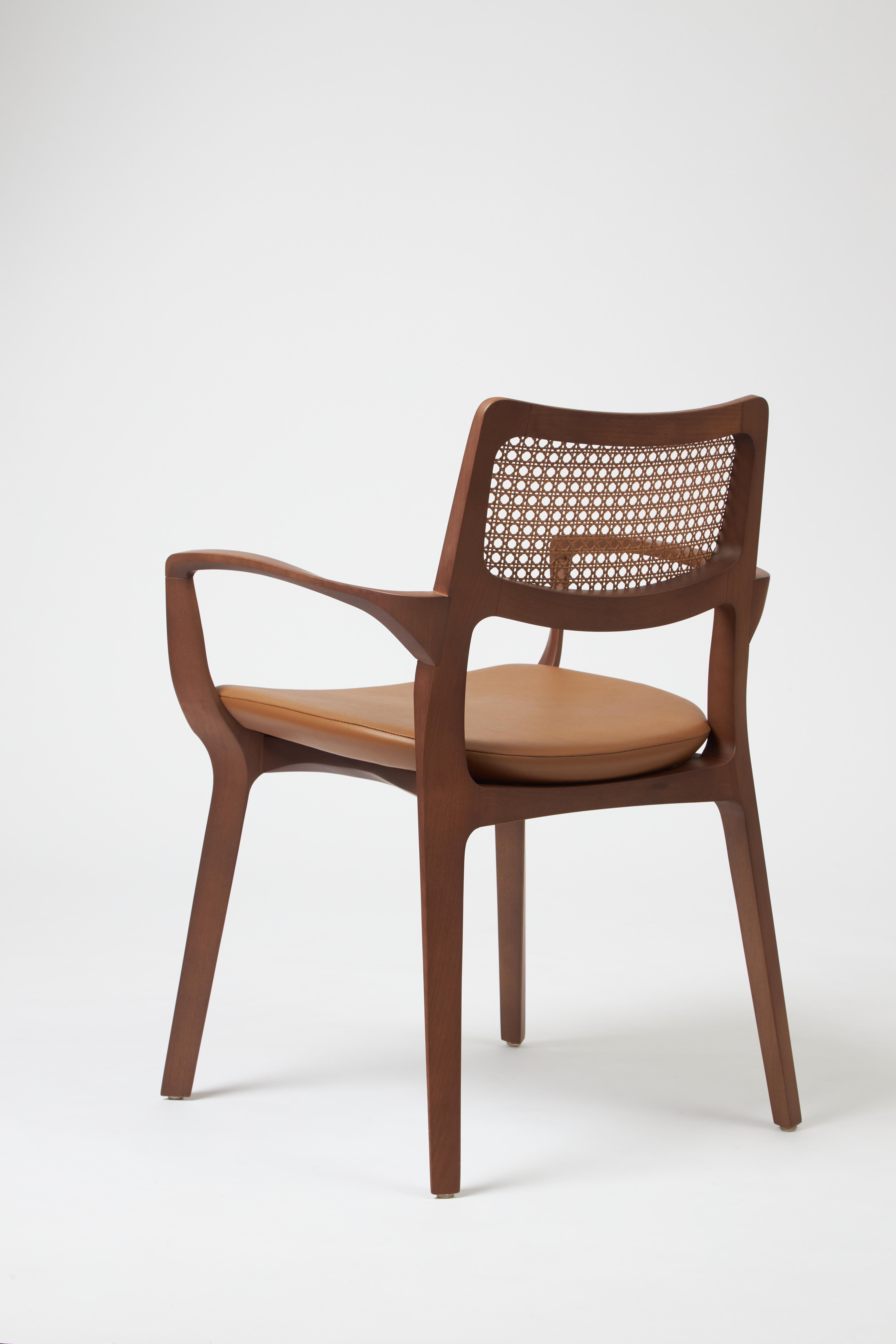 Caning Modern Style Aurora Chair Sculpted in Walnut Finish Arms, leather seating, cane For Sale