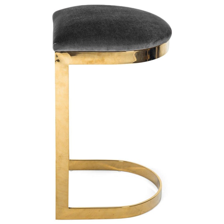 Similar in design to our Ibiza dining chair, except this stool is completely backless. Sitting atop of a brass curved base and featuring a rounded seat cushion adding comfort and style to your entertaining space. What an elegant way to have meals
