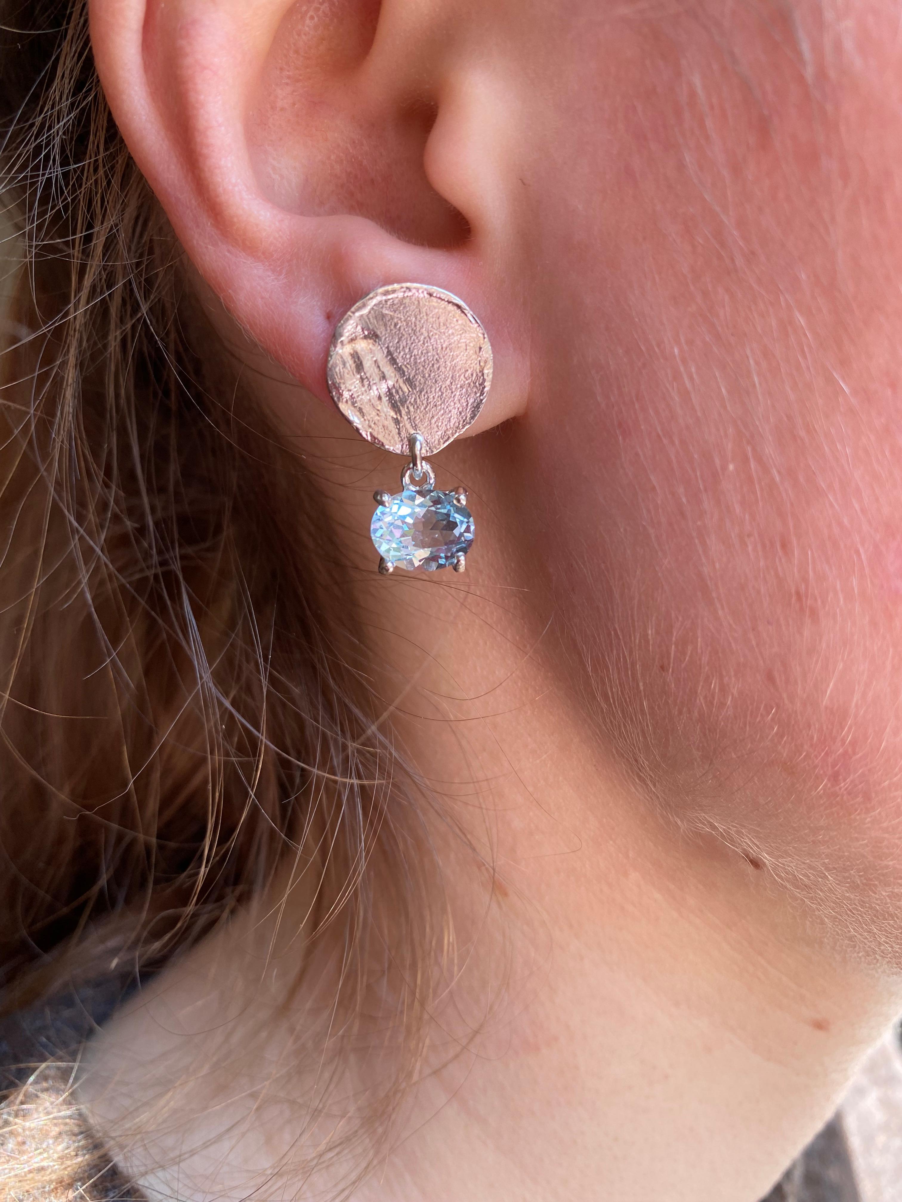 Rossella Ugolini Design Collection , a Modern Style Blue Moon Sterling Silver Topaz Handcrafted Dangle Design Earrings openly inspired to the color and the light of the full moon. The sculptural design provides an extra shiny surface of the disk and