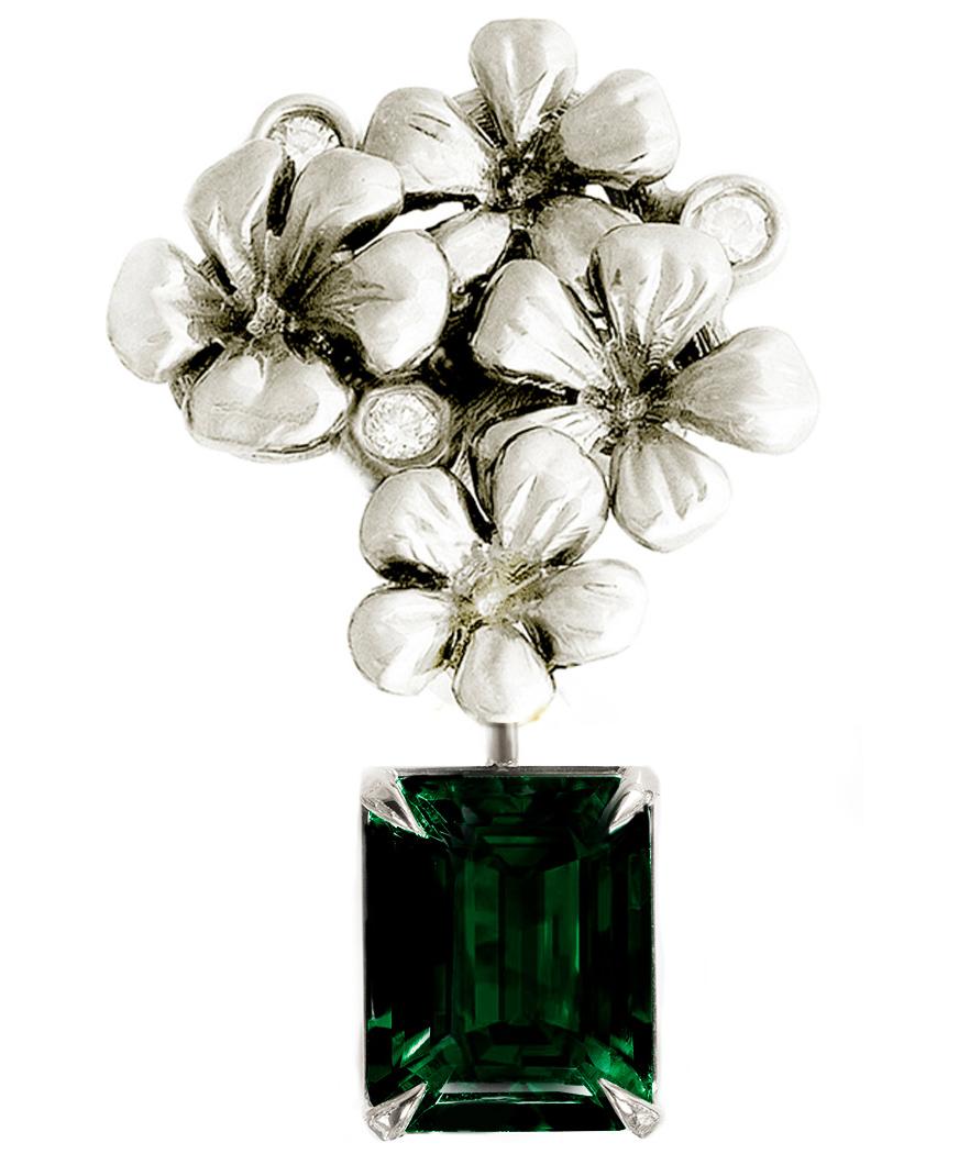 This contemporary 18 karat white gold brooch is encrusted with 3 round diamonds and a detachable green chromdiopside in octagon or cushion cut, measuring 9x7 mm. This jewelry collection was featured in a November review by Vogue UA.

The size of the
