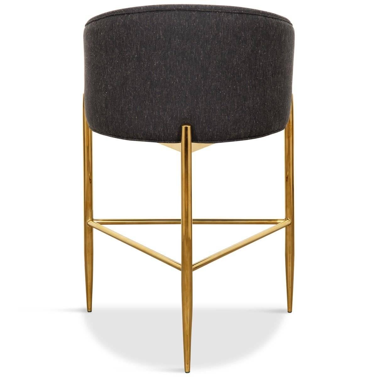 Similar in design to our Art Deco dining chair, this barstool is perfect for the bar. Sitting atop of a brass base with three long brass legs and featuring a curved upholstered back adding comfort and style to your entertaining space. What an