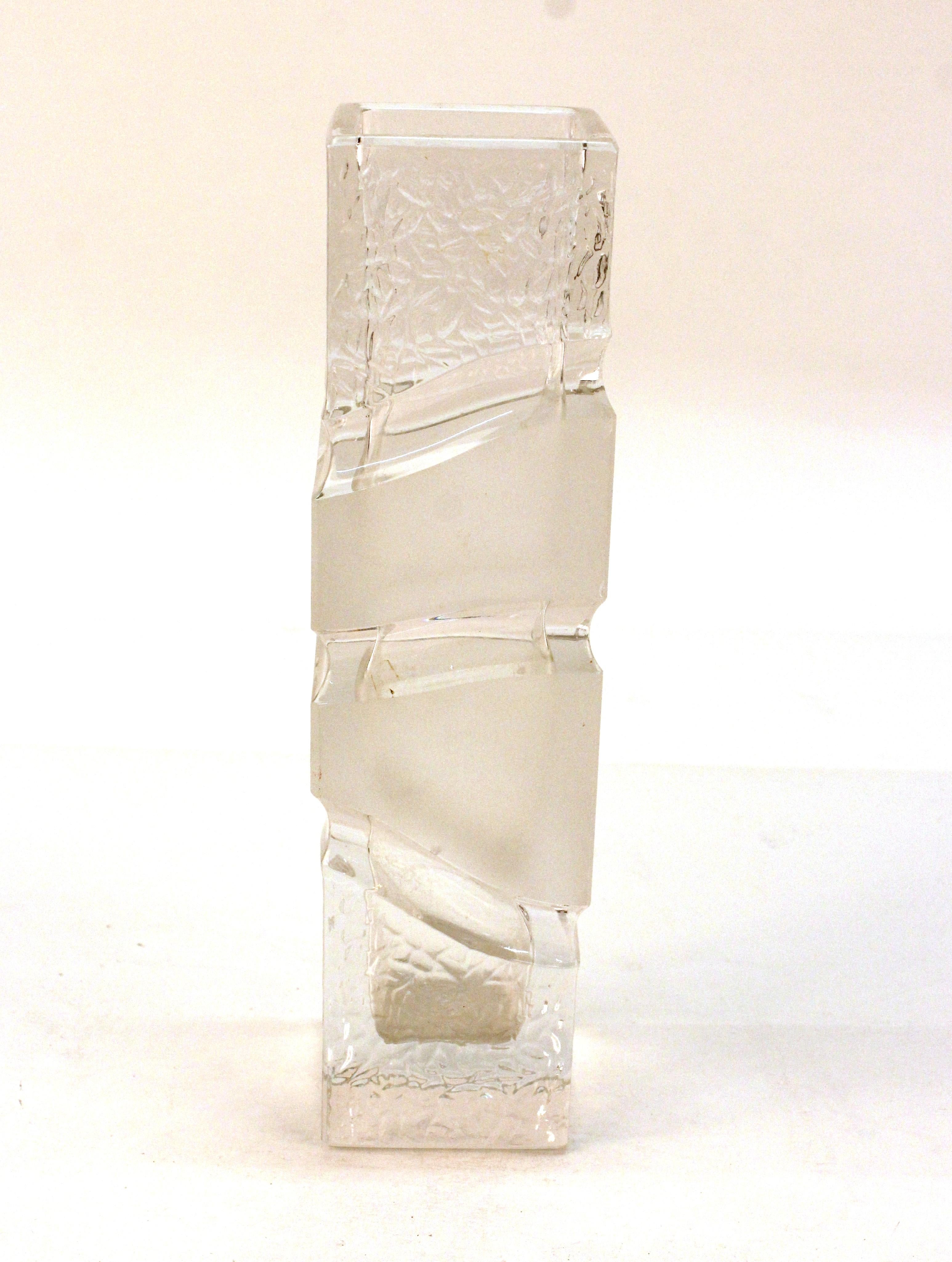 Modern style heavy glass vase with a square base and a wave-like motif in partly opaque glass. The piece has age-appropriate wear to the bottom and is in great vintage condition.