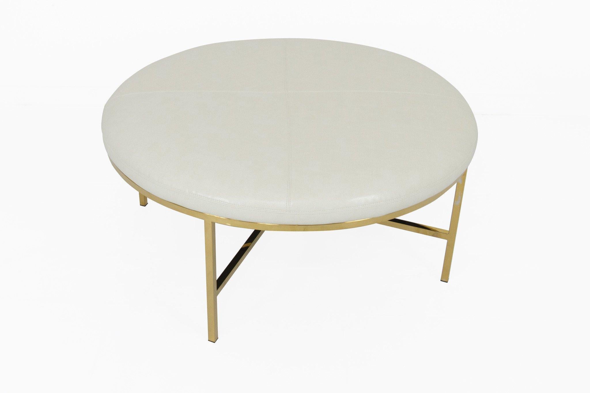 The beauty in our round Milan ottoman can be found in the arctic white faux leather to the brass legs. The size is perfect for smaller intimate spaces. If it's extra seating, footrest, or a table you are looking for. You have found it with