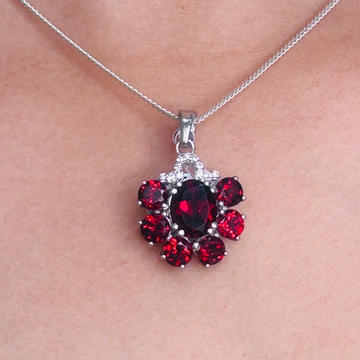 Modern Style Prong Set Garnet Pendant Necklace in sterling silver studded with oval, round cut garnet. This stunning piece of jewelry instantly elevates a casual look or dressy outfit.
Garnet Gemstone enhances the intellectual capacity of the