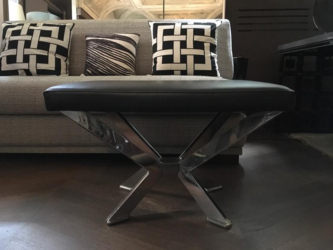 This contemporary style bench in cow black leather, is totally hand made in Italy. The feet are in chrome plated brass. The dimensions make it useful as coffee table.
   
