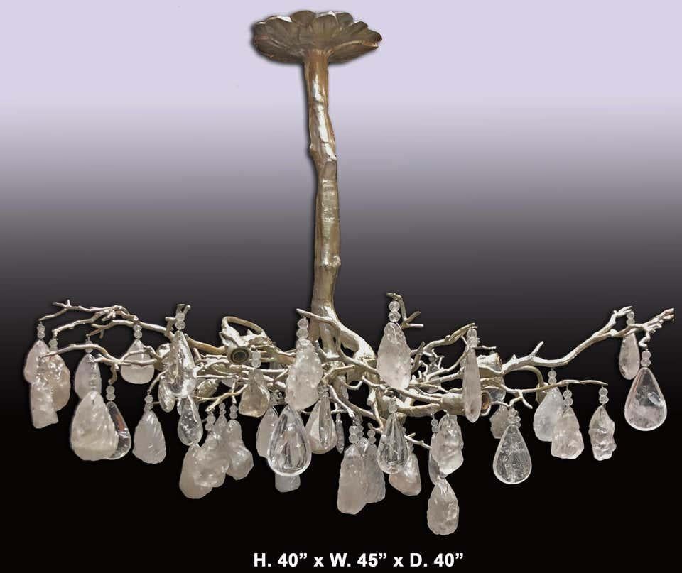 Exquisite hand carved and hand polished rock crystal silver leafed Borghese bronze tree chandelier. Exhibiting a truly beautiful Modern style naturalistic tree design. Dressed in both tumbled rock crystal nuggets and rock crystal smooth full