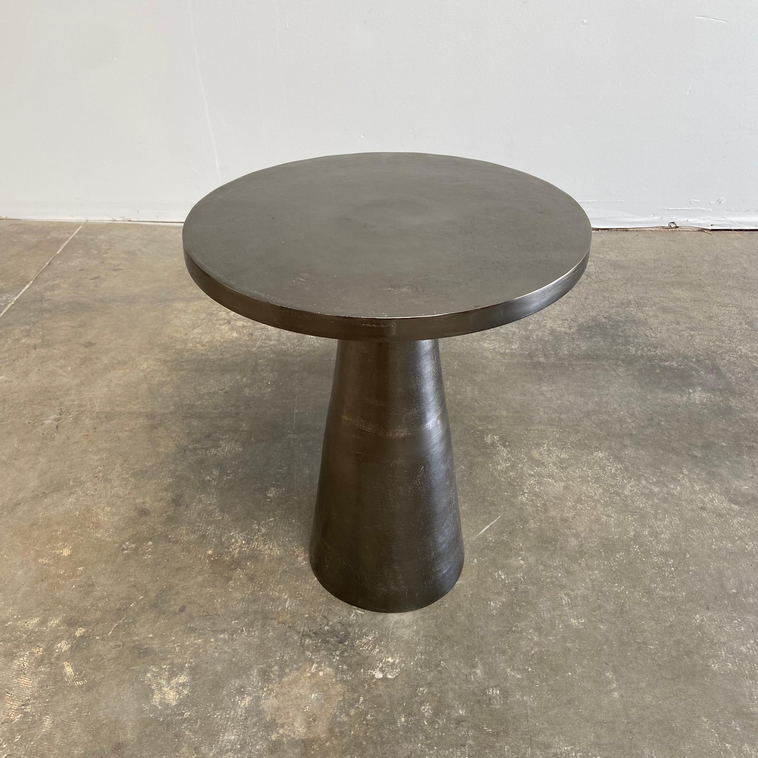 Antique pewter colored side side table.
Top has an antique patina, to look as if it is aged. Its sleek clean moder edge is smooth, this table is light weight, easy to use anywhere in the home.
Size: 19-1/2” RD. X 23” H.