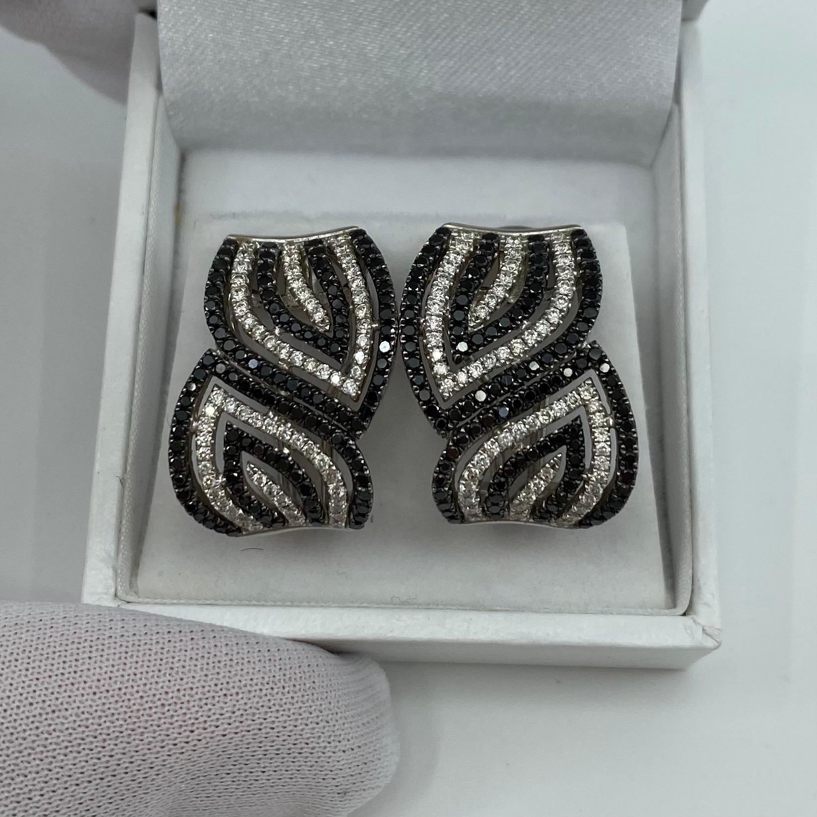 Round Cut Modern Stylish Black and White Diamond 18 Karat White Gold Swirl Stud Earrings For Sale