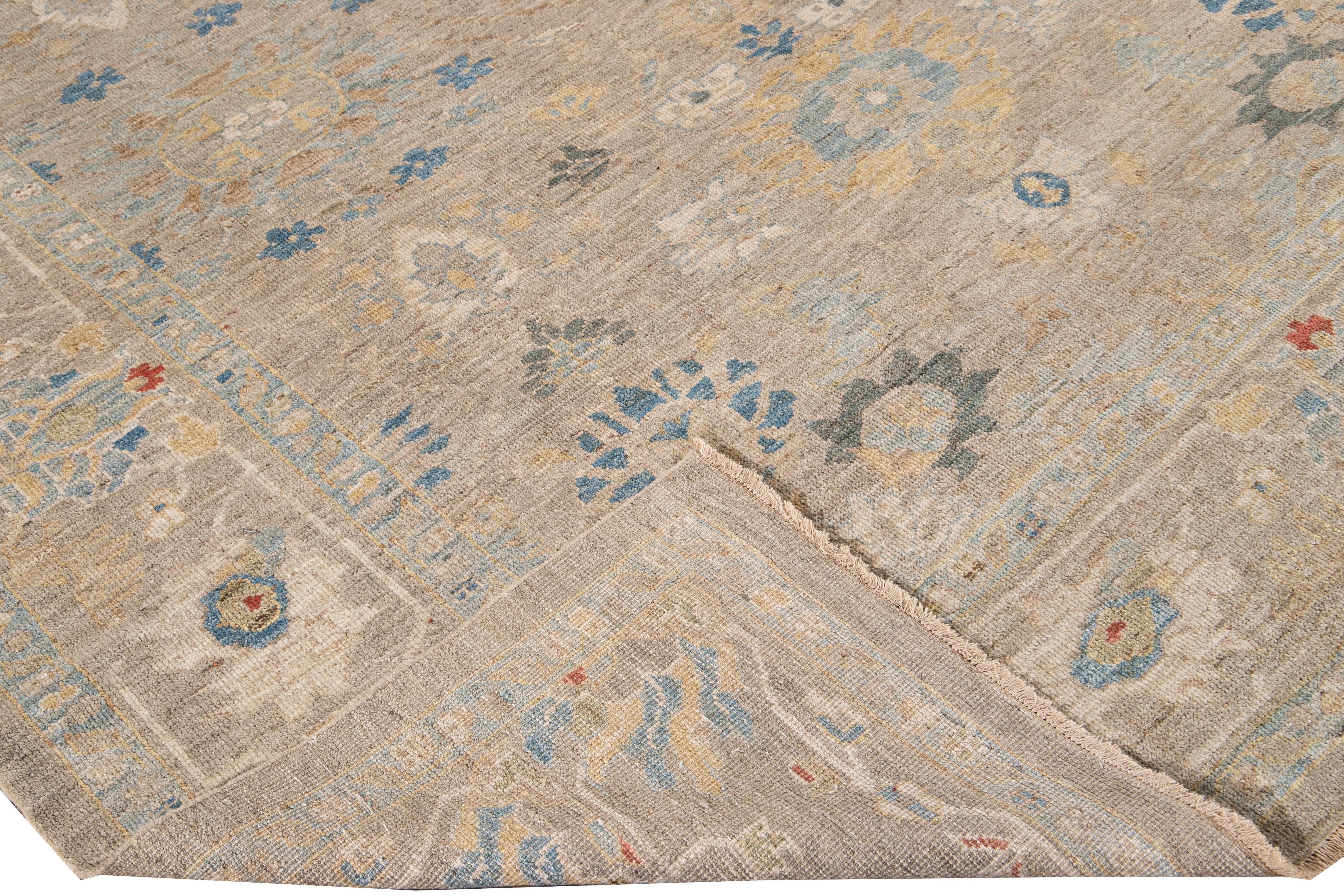 Beautiful modern Sultanabad hand-knotted wool rug with a beige field. This Sultanabad rug has an ivory, yellow, blue, and orange accent in a gorgeous all-over Classic floral design.

This rug measures: 8'4