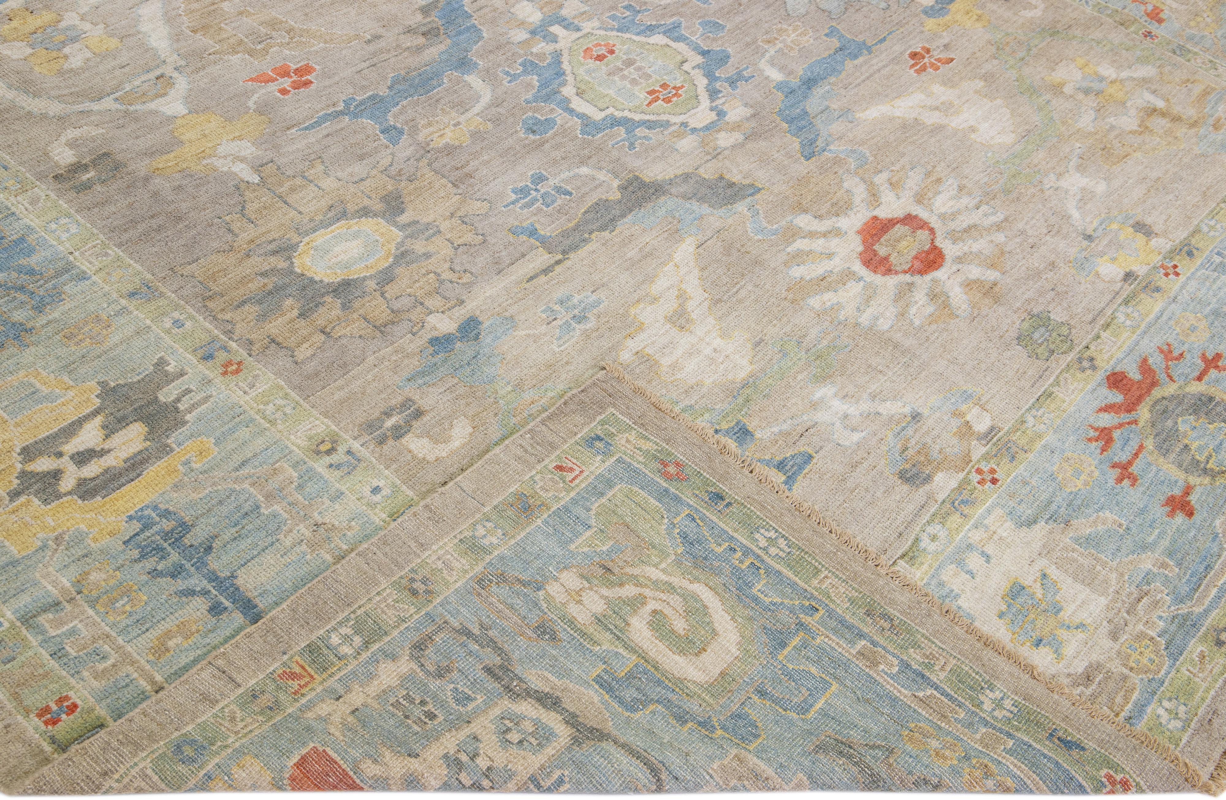 Beautiful modern Sultanabad hand-knotted wool rug with a beige field. This Sultanabad rug has a blue frame and multicolor accents in a gorgeous all-over classic floral pattern design.

This rug measures: 10