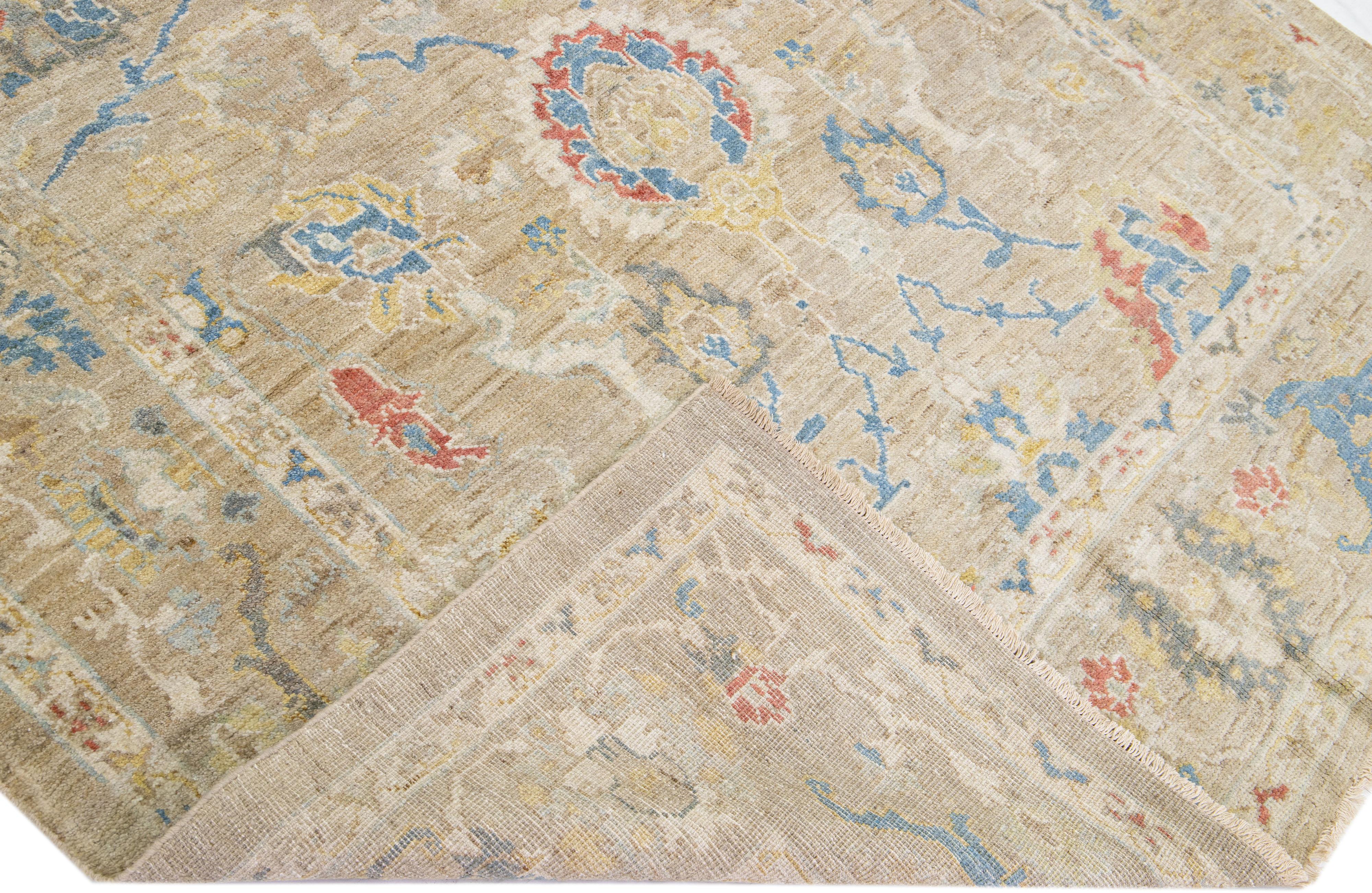 Beautiful modern Sultanabad hand-knotted oversize wool rug with a beige color field. This rug has multicolor accents in a gorgeous all-over floral design.

This rug measures: 6'4