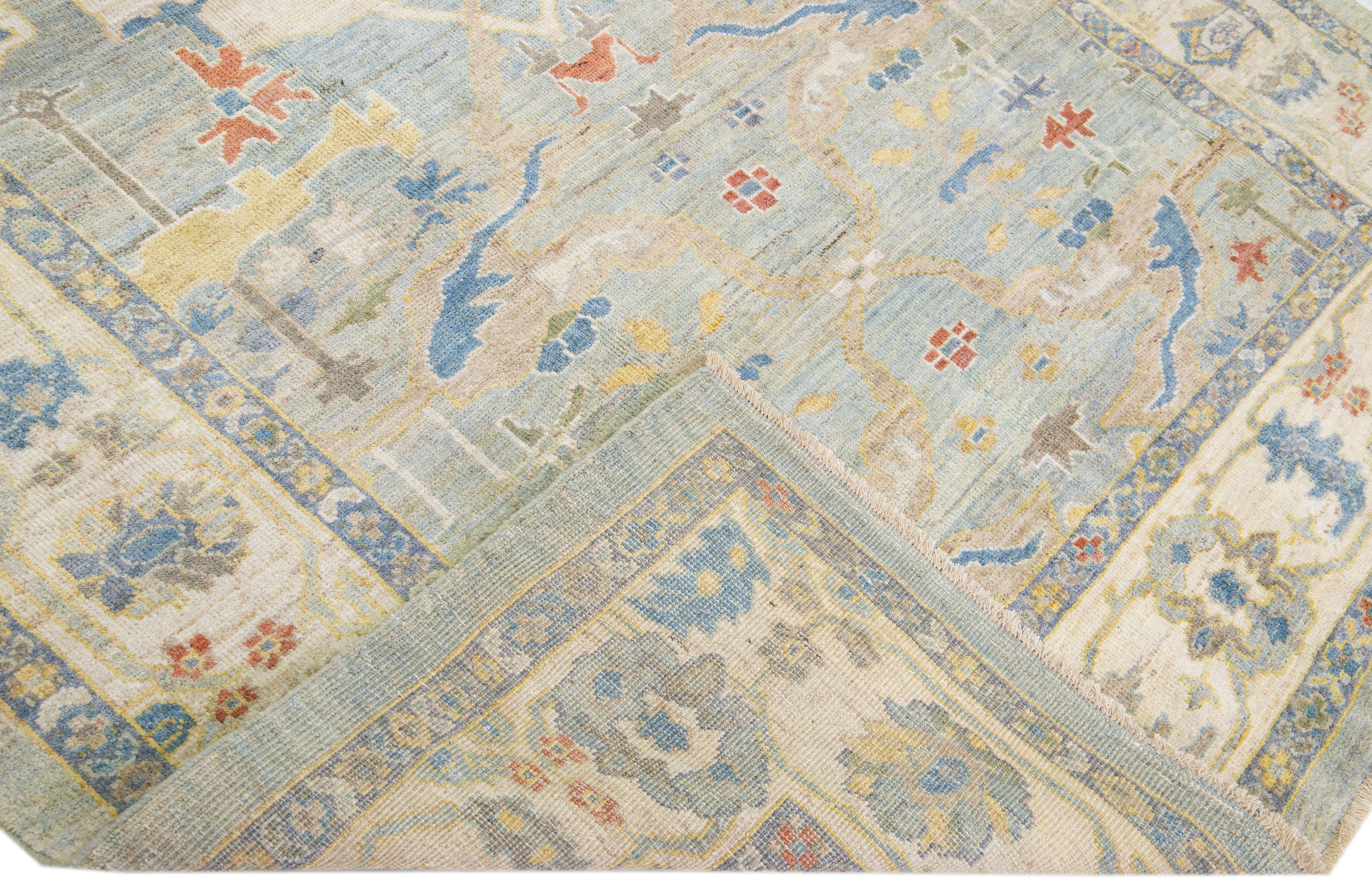 Beautiful modern Sultanabad hand-knotted wool rug with a blue color field. This rug has a beige frame and multicolor accents in a gorgeous all-over floral design.

This rug measures: 6'7