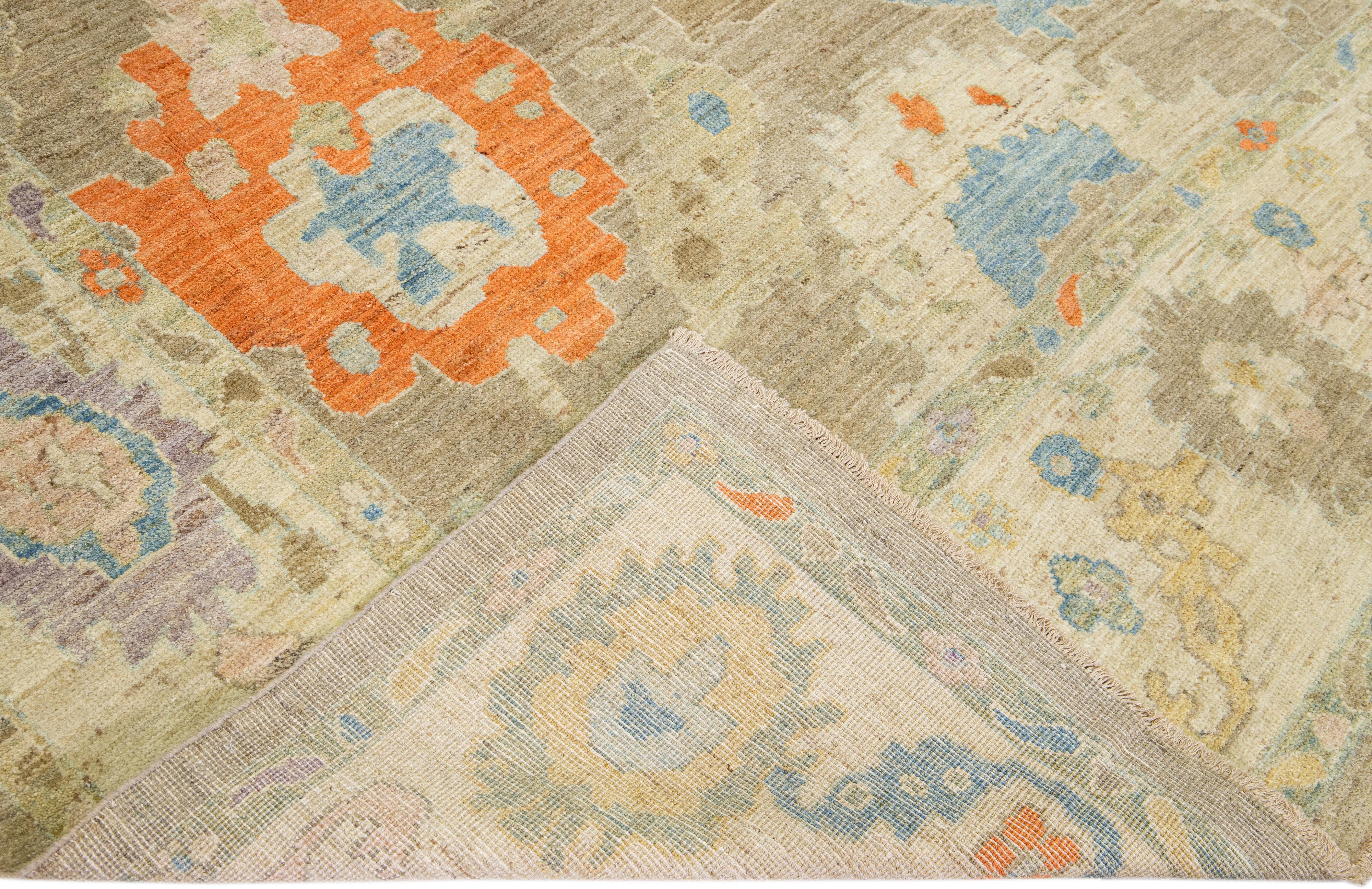 Beautiful modern Sultanabad hand-knotted wool rug with a brown field. This Sultanabad rug has a beige frame and multicolor accents in a gorgeous all-over classic floral pattern design.

This rug measures: 8'1
