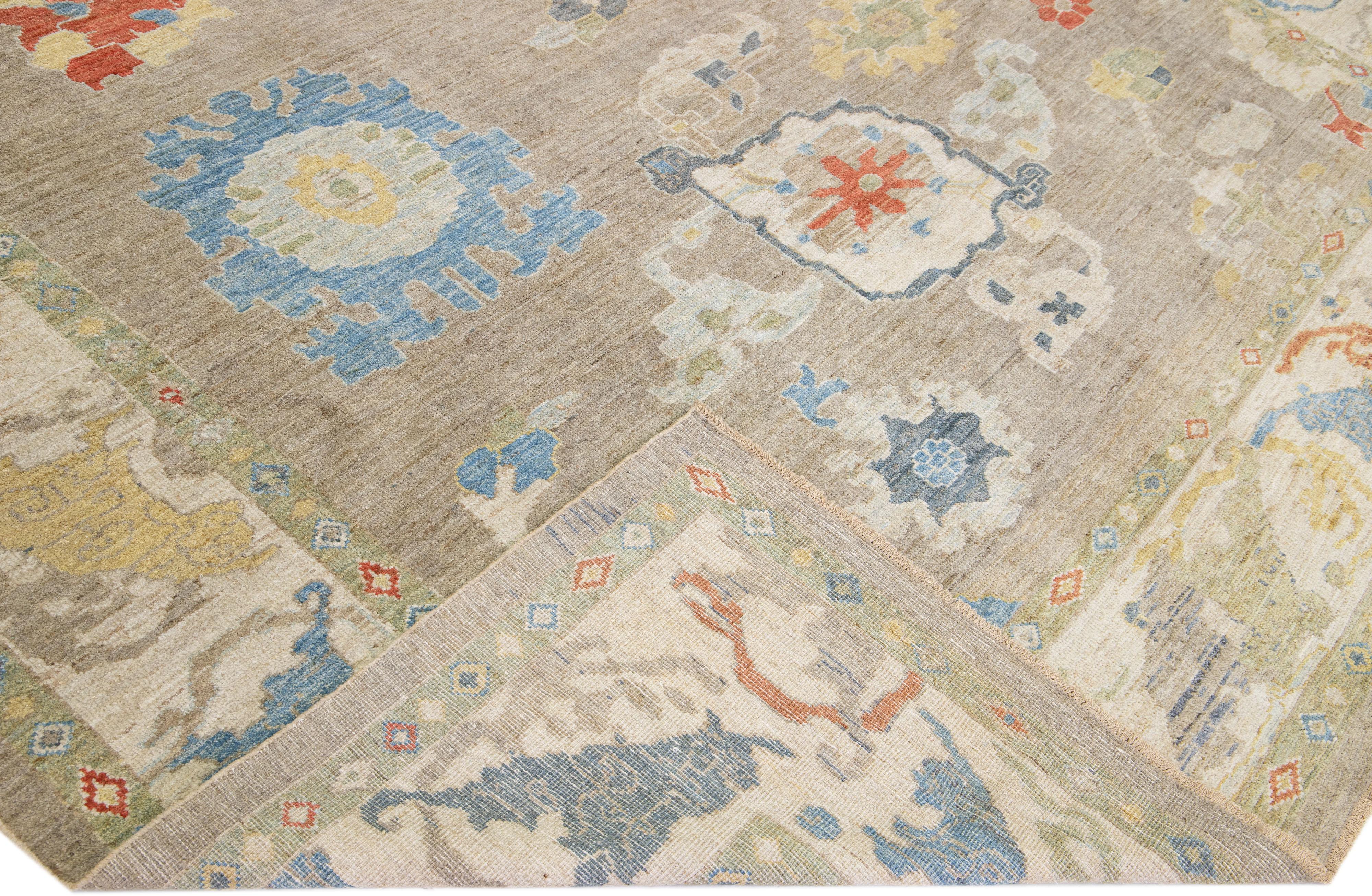 Beautiful modern Sultanabad hand-knotted wool rug with a brown color field. This rug has a beige frame and multicolor accents in a gorgeous all-over floral design.

This rug measures: 10'8