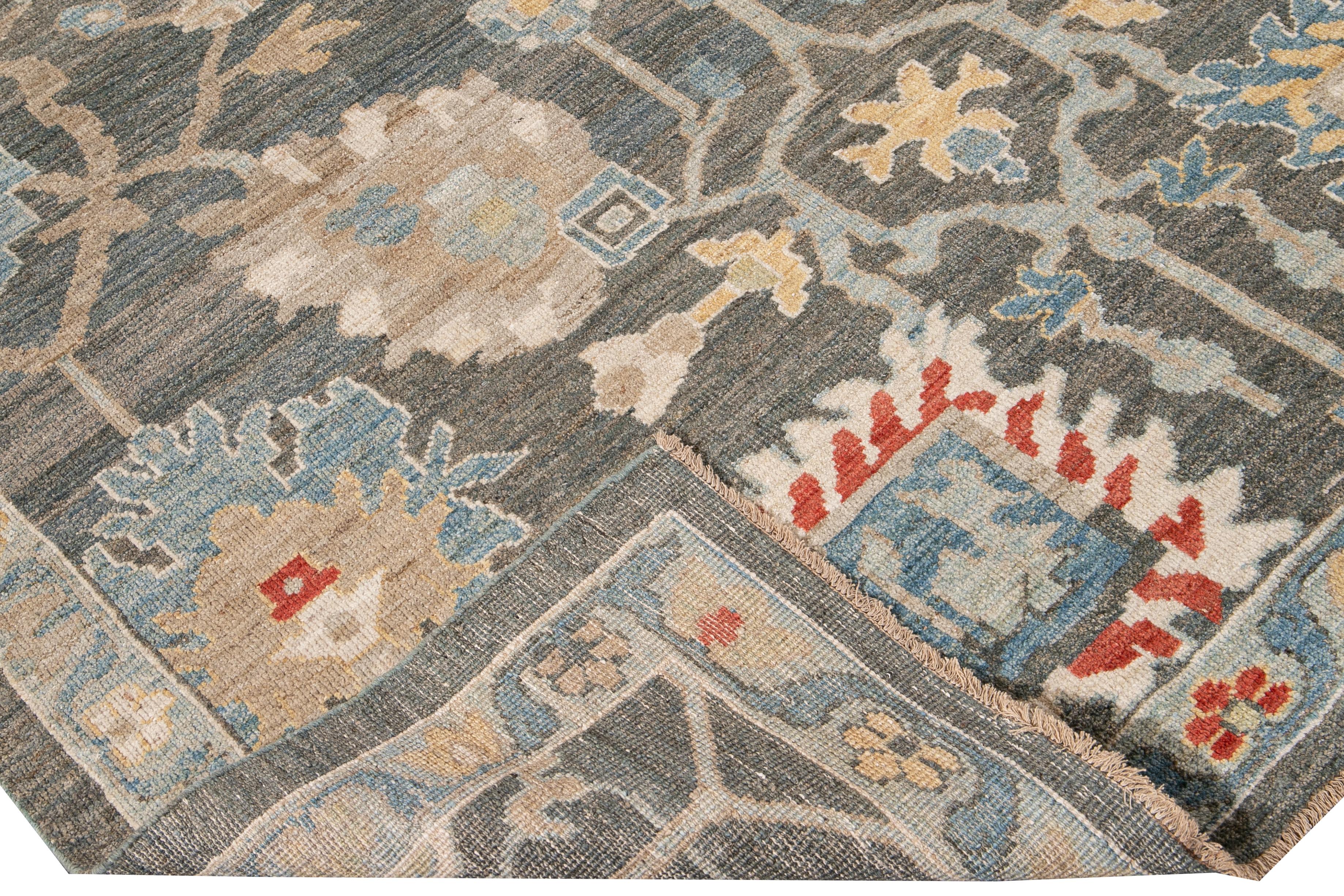 Beautiful modern Sultanabad hand-knotted wool rug with a gray field. This Sultanabad rug has an ivory, yellow, blue, and orange accent in a gorgeous all-over Classic geometric floral design.

This rug measures: 8'8
