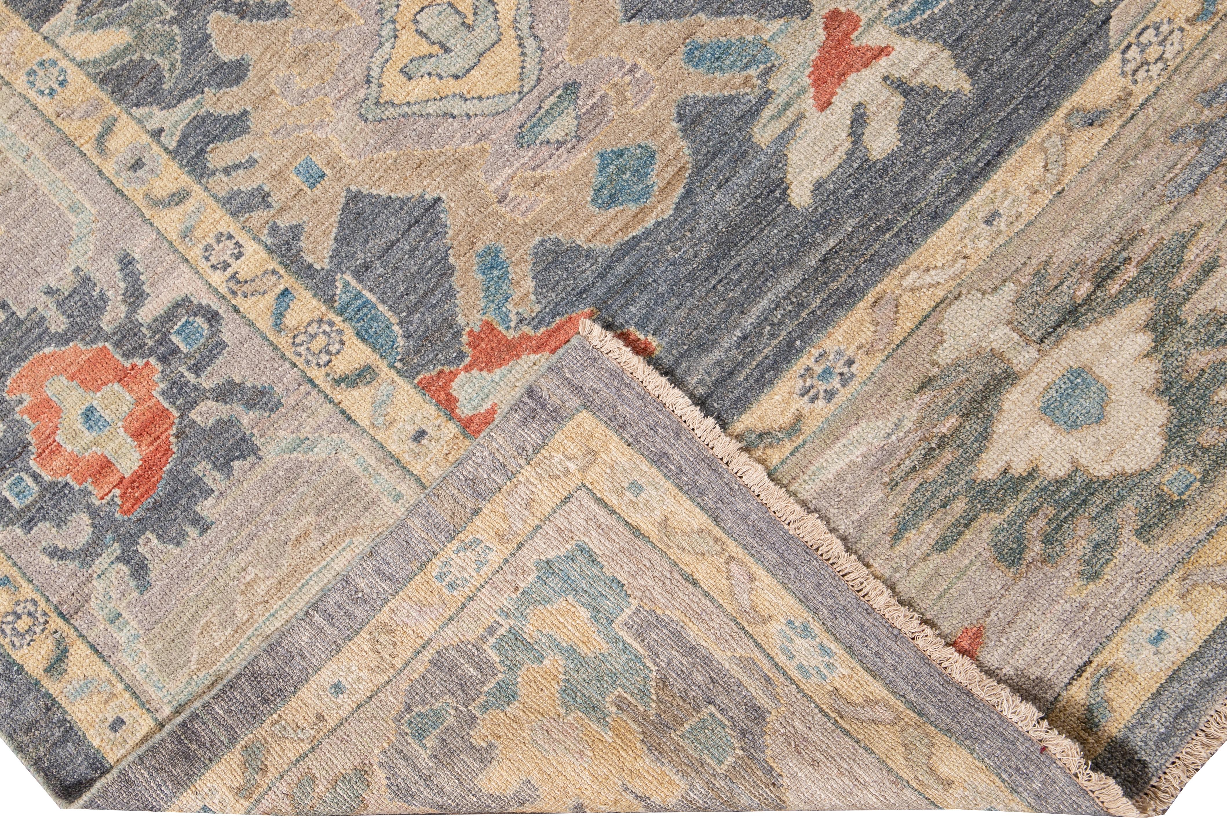 Beautiful modern Sultanabad hand-knotted wool rug with a gray field. This Sultanabad rug has yellow, blue, green, and orange accents in a gorgeous all-over geometric floral design.

This rug measures: 10'3