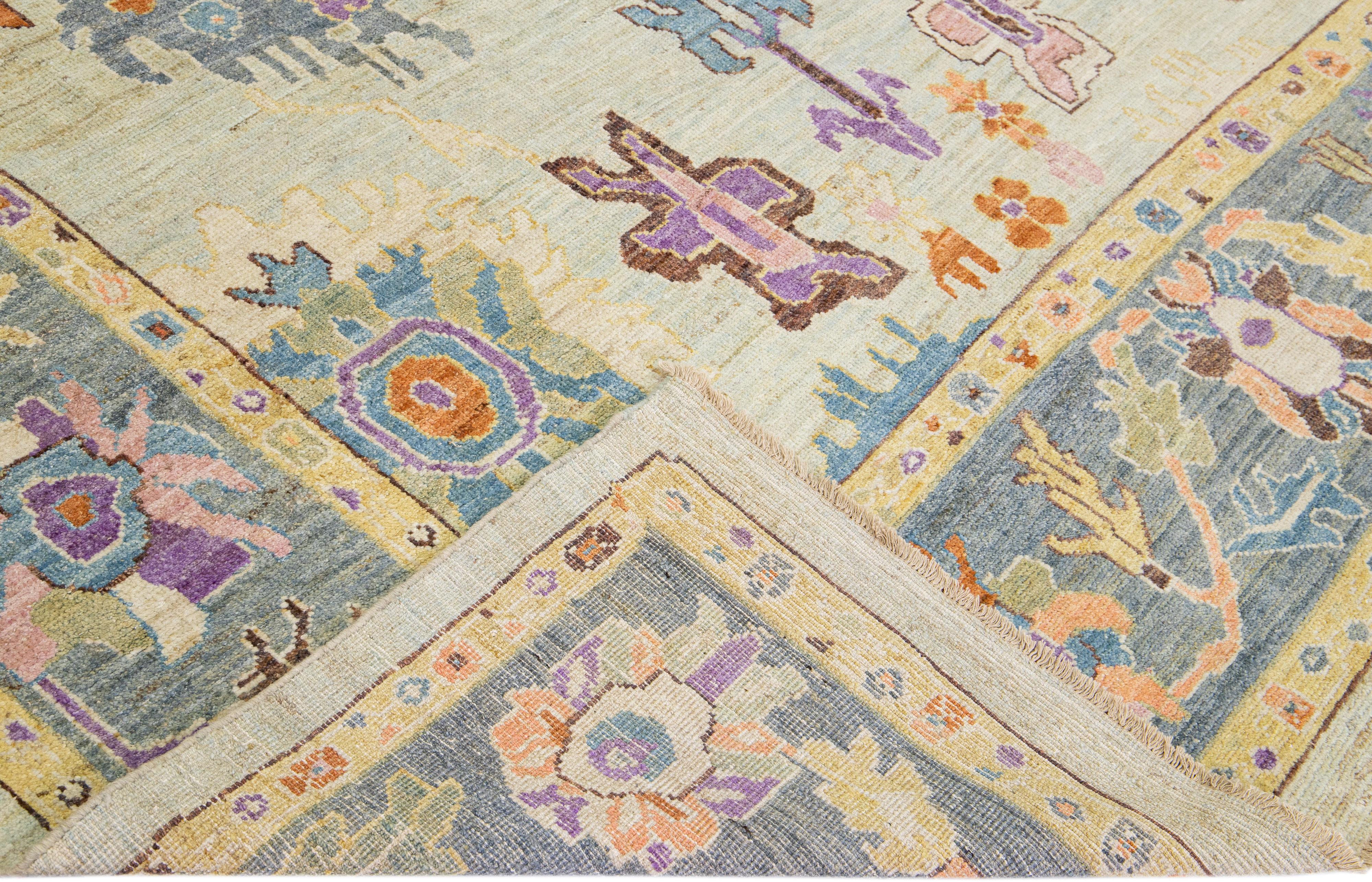 Beautiful modern Sultanabad hand-knotted wool rug with a green field. This Sultanabad rug has a blue frame and multicolor accents in a gorgeous all-over classic floral pattern design.

This rug measures: 8'4