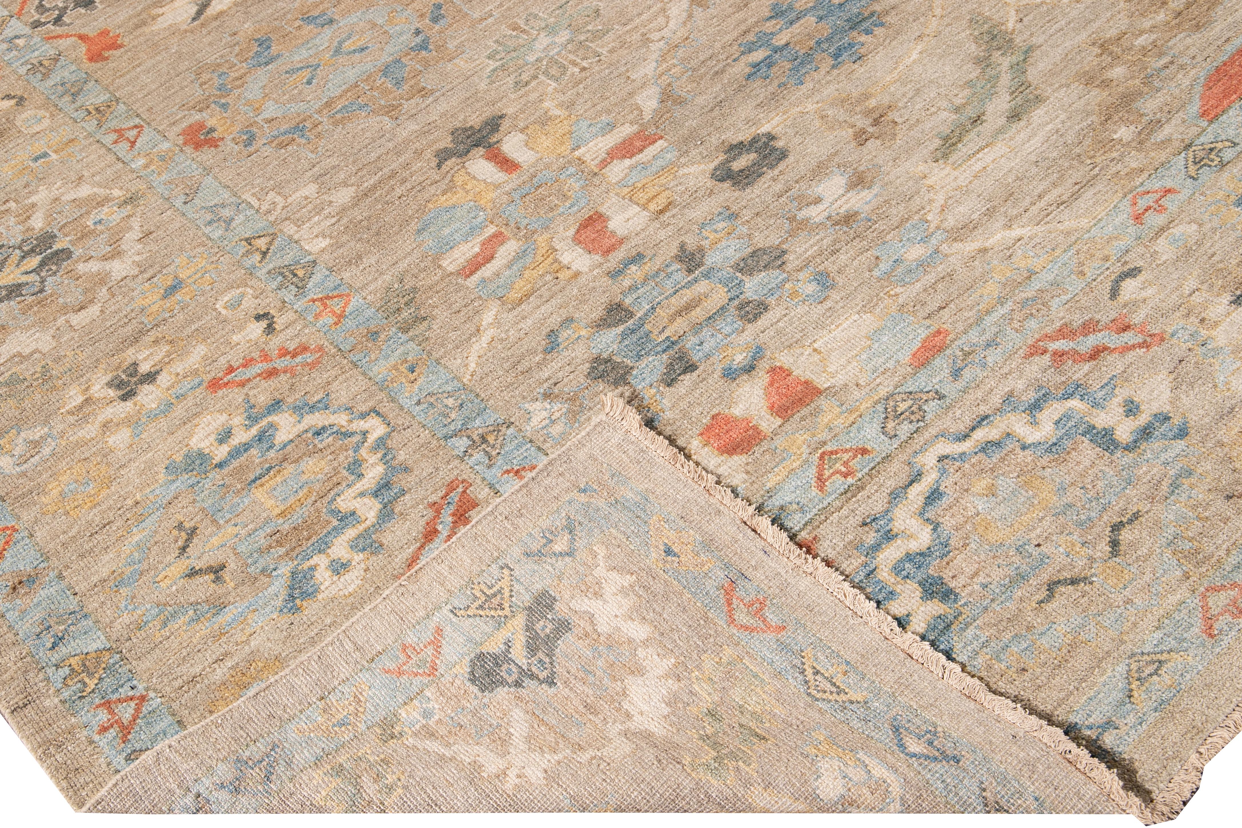 Beautiful modern Oversize Sultanabad hand-knotted wool rug with a beige field. This Sultanabad rug has ivory, yellow, blue, and orange accents in a gorgeous all-over Classic geometric floral design.

This rug measures: 10'11