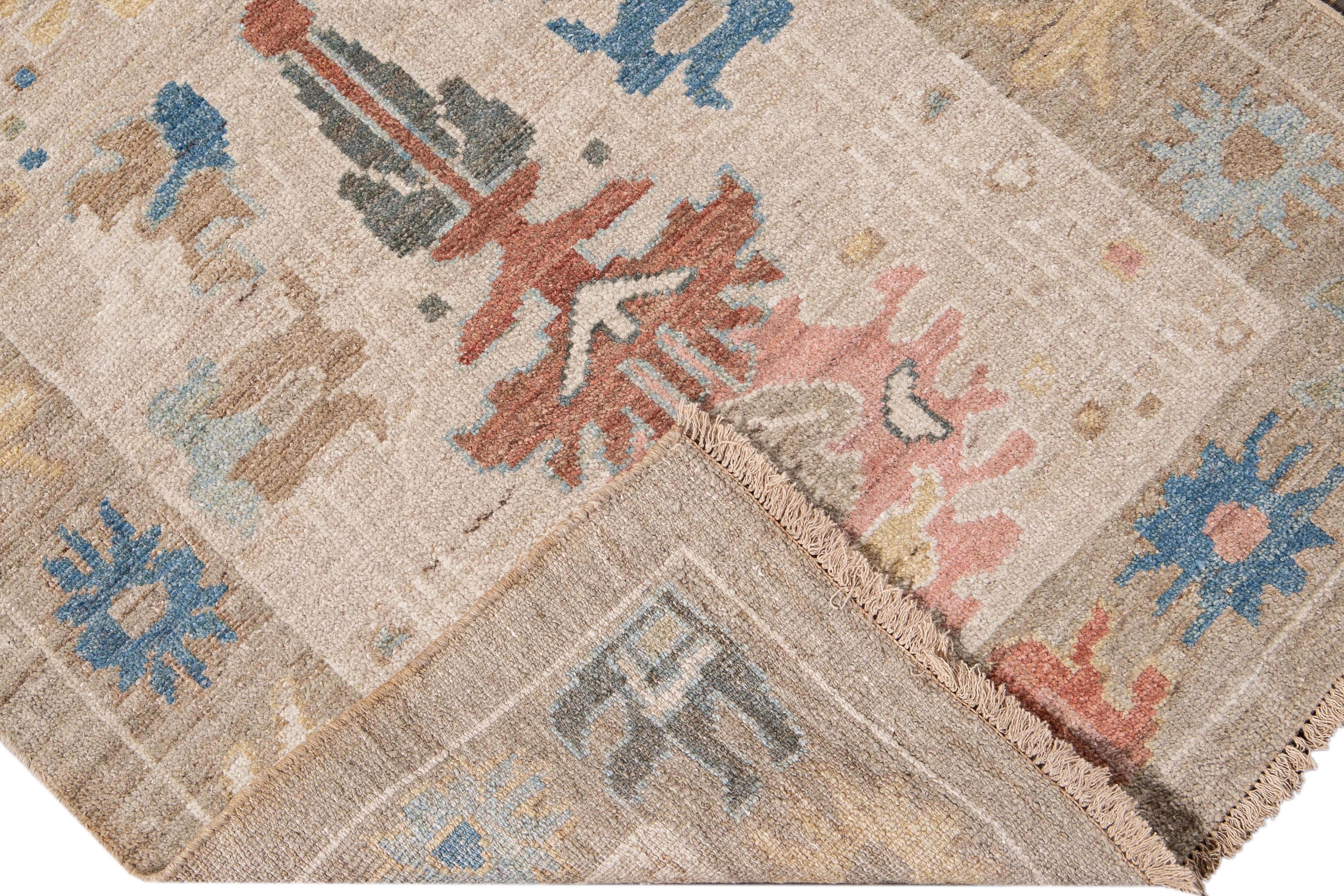 Beautiful modern Sultanabad hand-knotted wool runner with a beige field. This Sultanabad runner has a tan frame and yellow, blue, pink, and brown accent in a gorgeous all-over Classic floral design.

This rug measures: 3' x 22'10