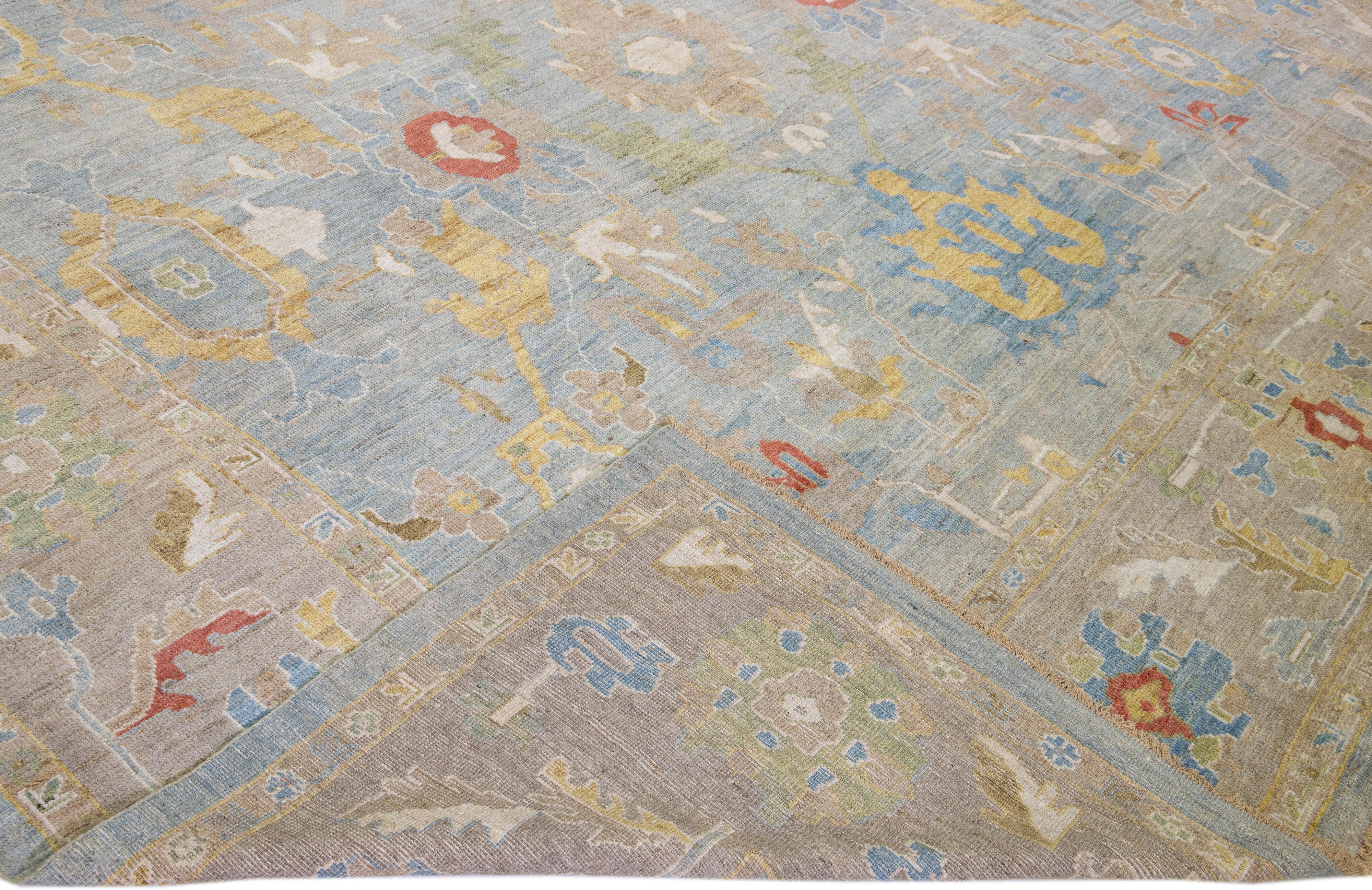 Beautiful modern Sultanabad hand-knotted wool rug with a blue field. This Sultanabad rug has a brown frame and multicolor accents in a gorgeous all-over classic floral pattern design.

This rug measures: 12'11