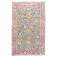 The Modernsabad Handmade Floral Motif Blue & Purple Wool Rug (Tapis de laine bleu et violet)