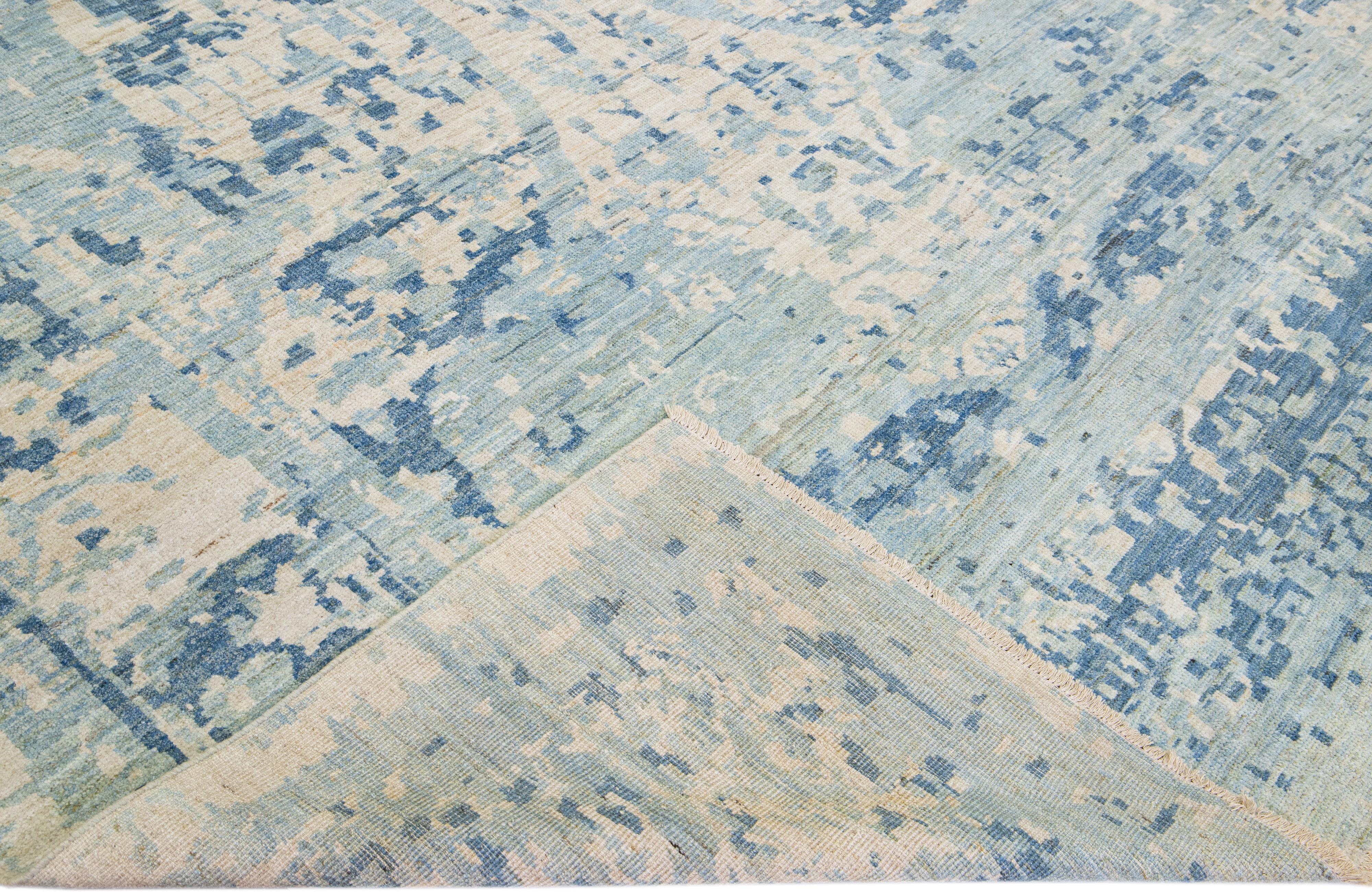 Beautiful modern Sultanabad hand-knotted wool rug with a blue field. This Sultanabad rug has beige accents in a gorgeous all-over classic floral pattern design.

This rug measures: 9