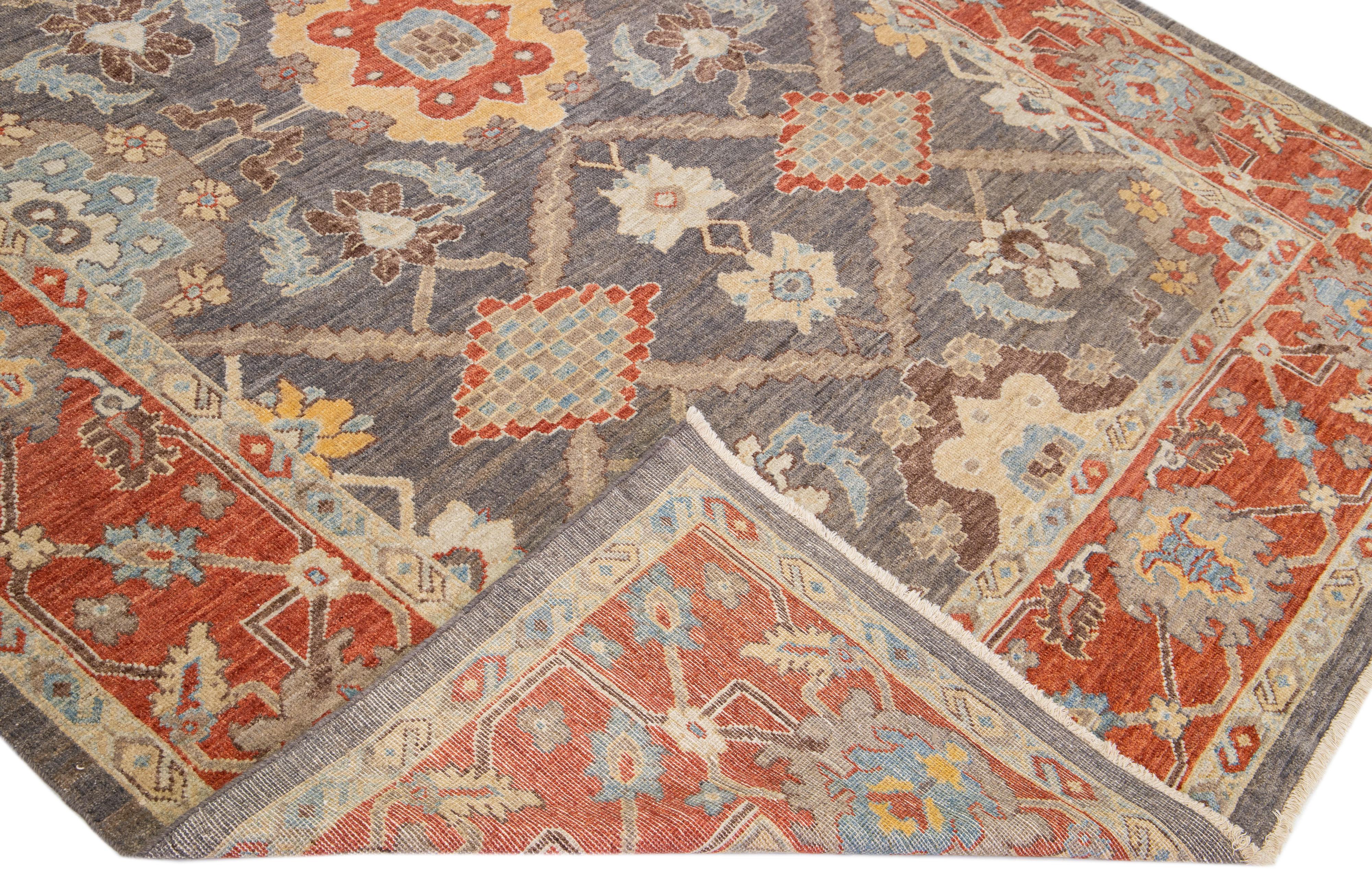 Beautiful modern Sultanabad hand-knotted wool rug with a gray color field. This rug has red, yellow, and blue accents in a gorgeous all-over floral design.

This rug measures: 8'3