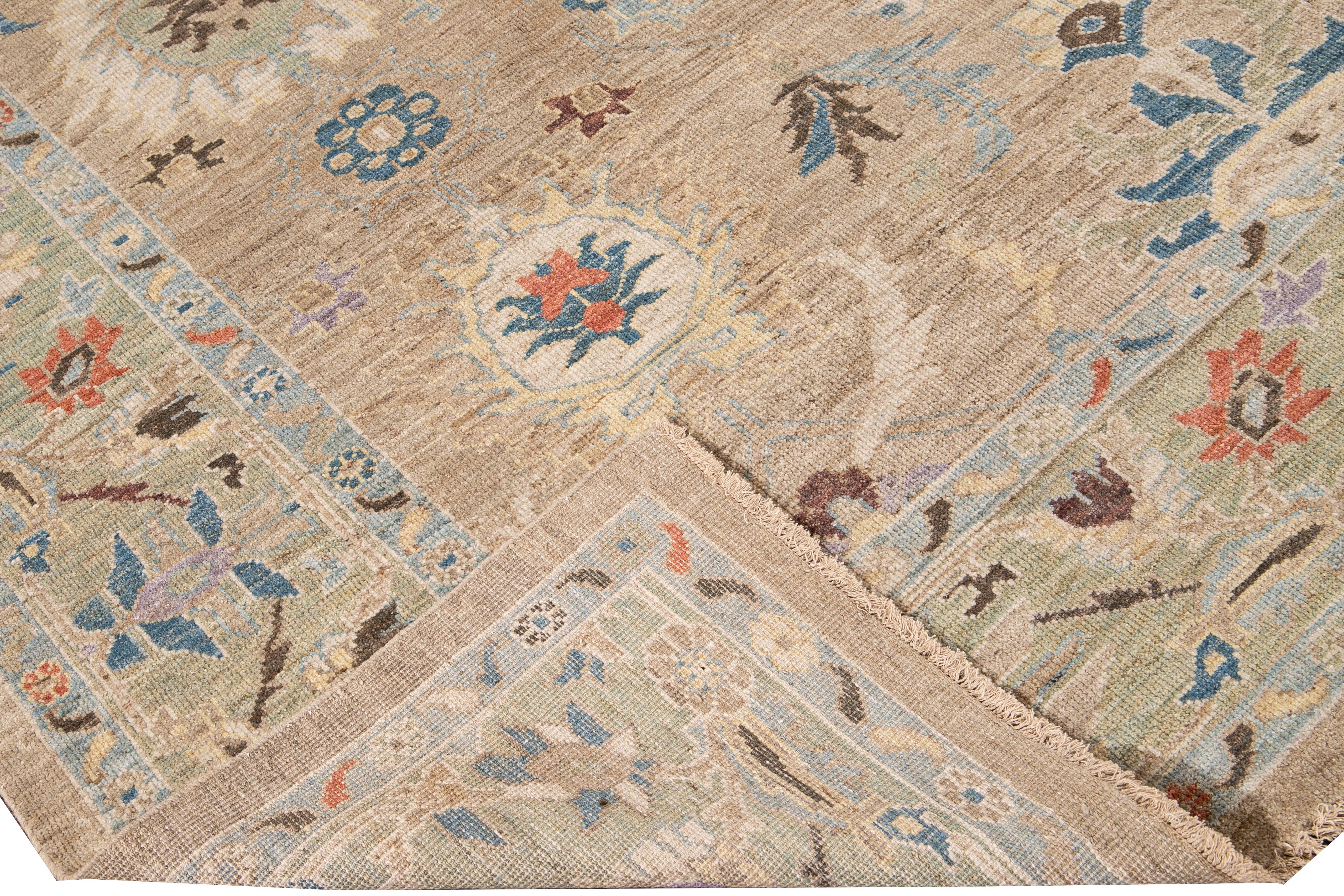 Beautiful modern Sultanabad hand-knotted wool rug with a tan field. This Sultanabad rug has a green frame and multi-color accent in a gorgeous all-over Classic floral medallion design.

This rug measures: 8'4