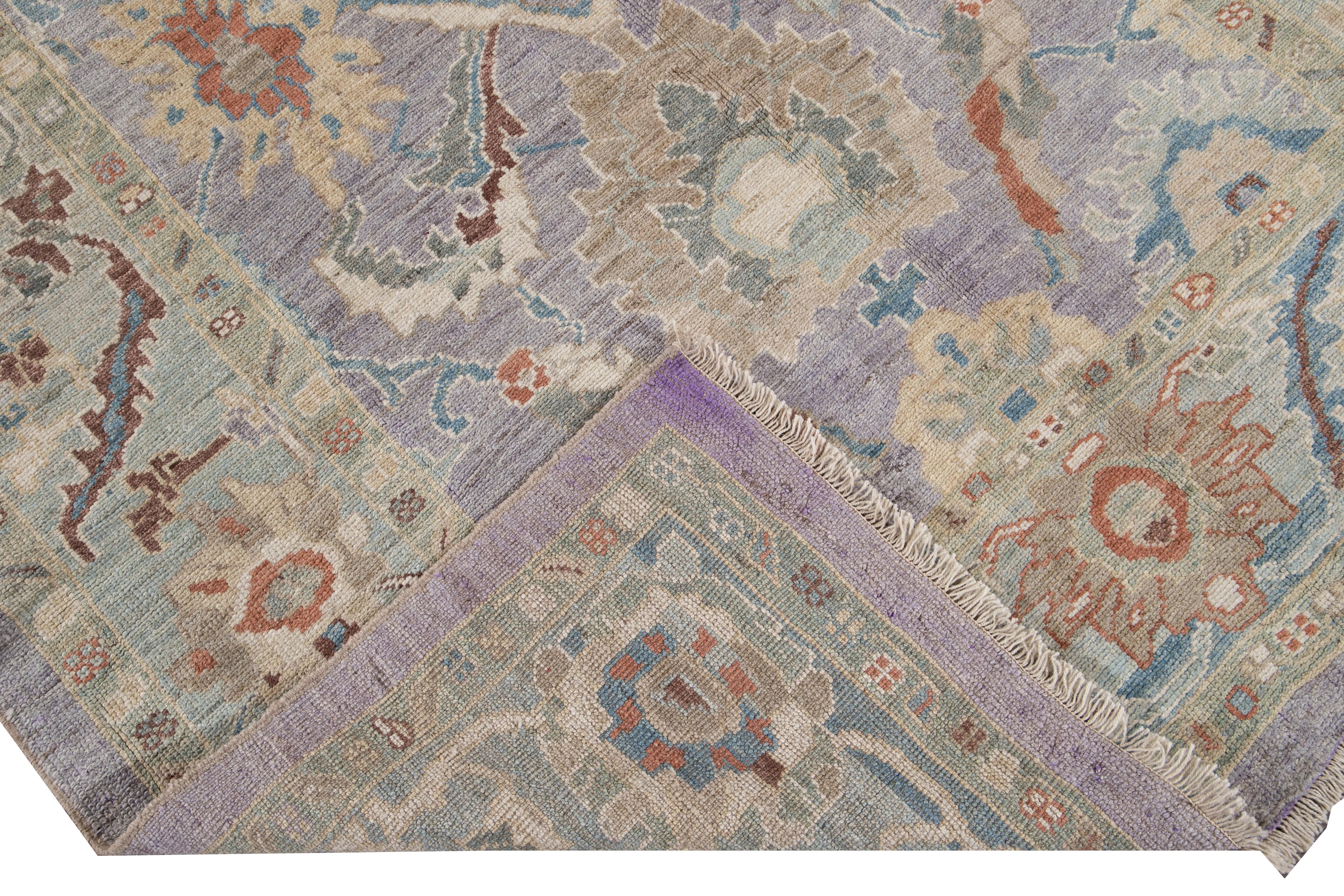Beautiful modern Sultanabad hand knotted wool rug with a purple field. This Sultanabad rug has a blue frame and multi-color accent in a gorgeous all-over Classic floral medallion design.

This rug measures: 6' x 8'5