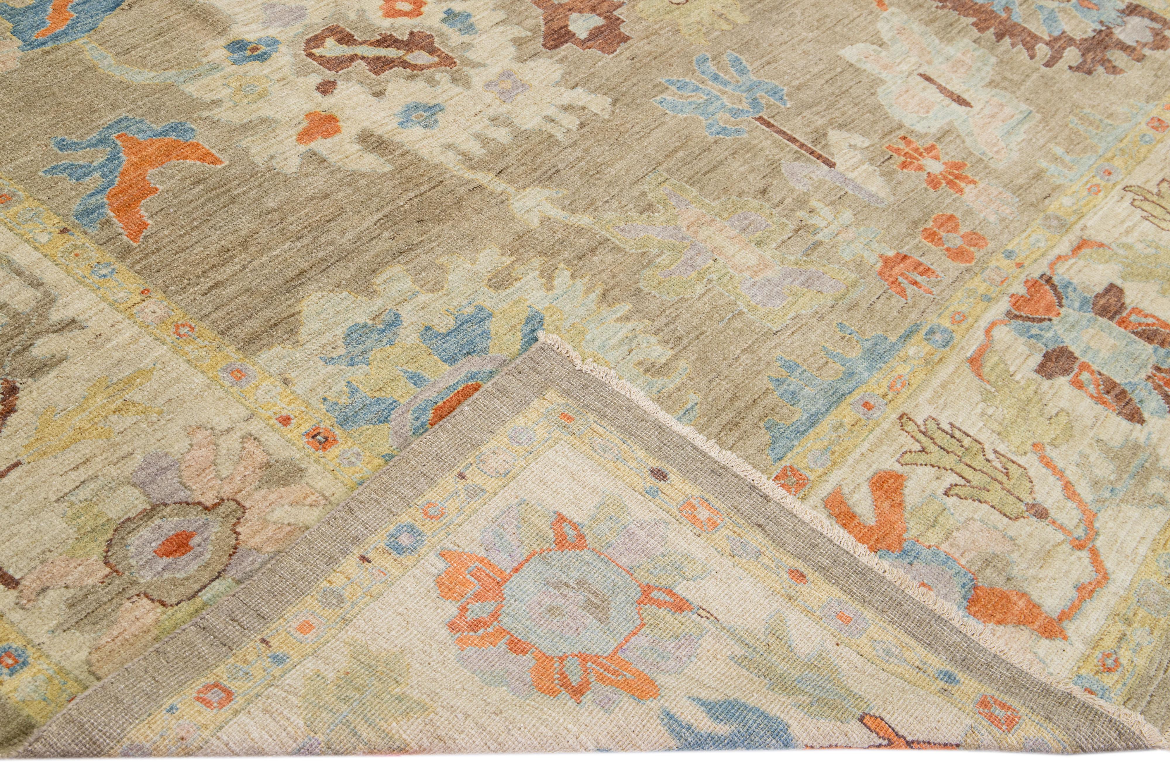 Beautiful modern Sultanabad hand-knotted wool rug with a light brown field. This Sultanabad rug has a beige frame and multicolor accents in a gorgeous all-over classic floral pattern design.

This rug measures: 10'2