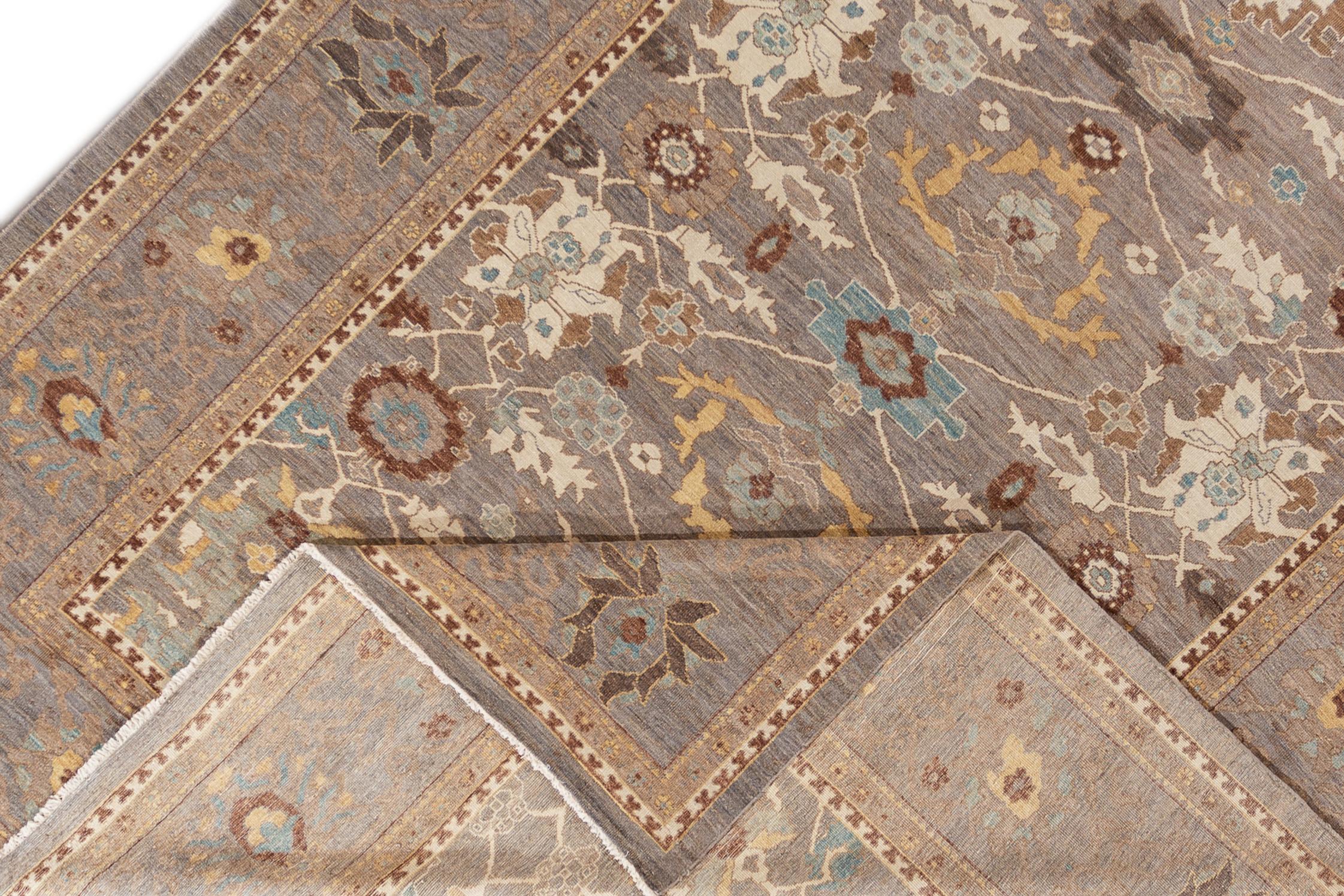 This hand knotted wool rug measures 10'10