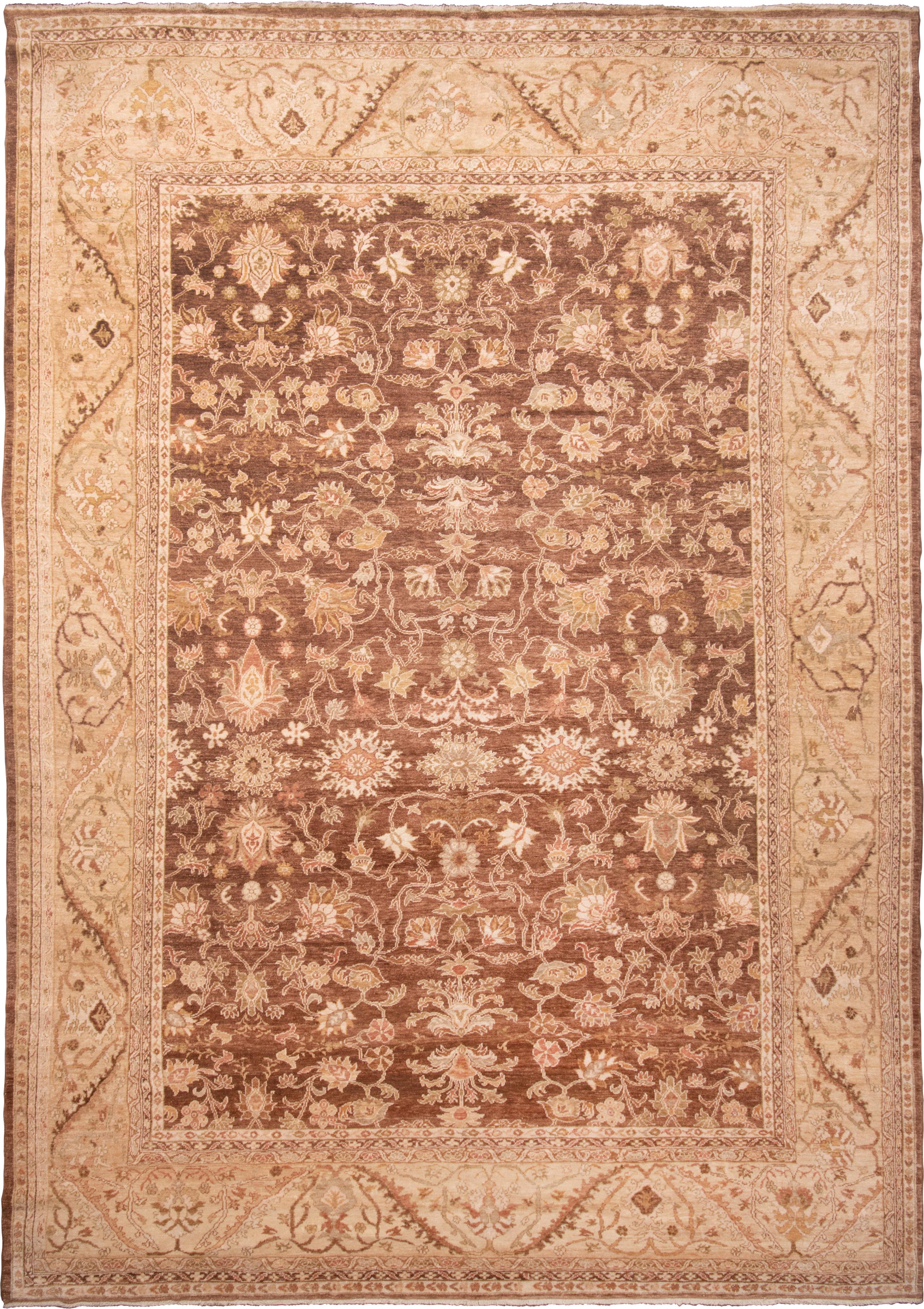 Originating from Turkey, this modern traditional Sultanabad rug enjoys several classic antique design elements with an uncommon color scheme. Hand knotted with mahal wool, much finer than normal wool creating an almost shimmering luster like that of