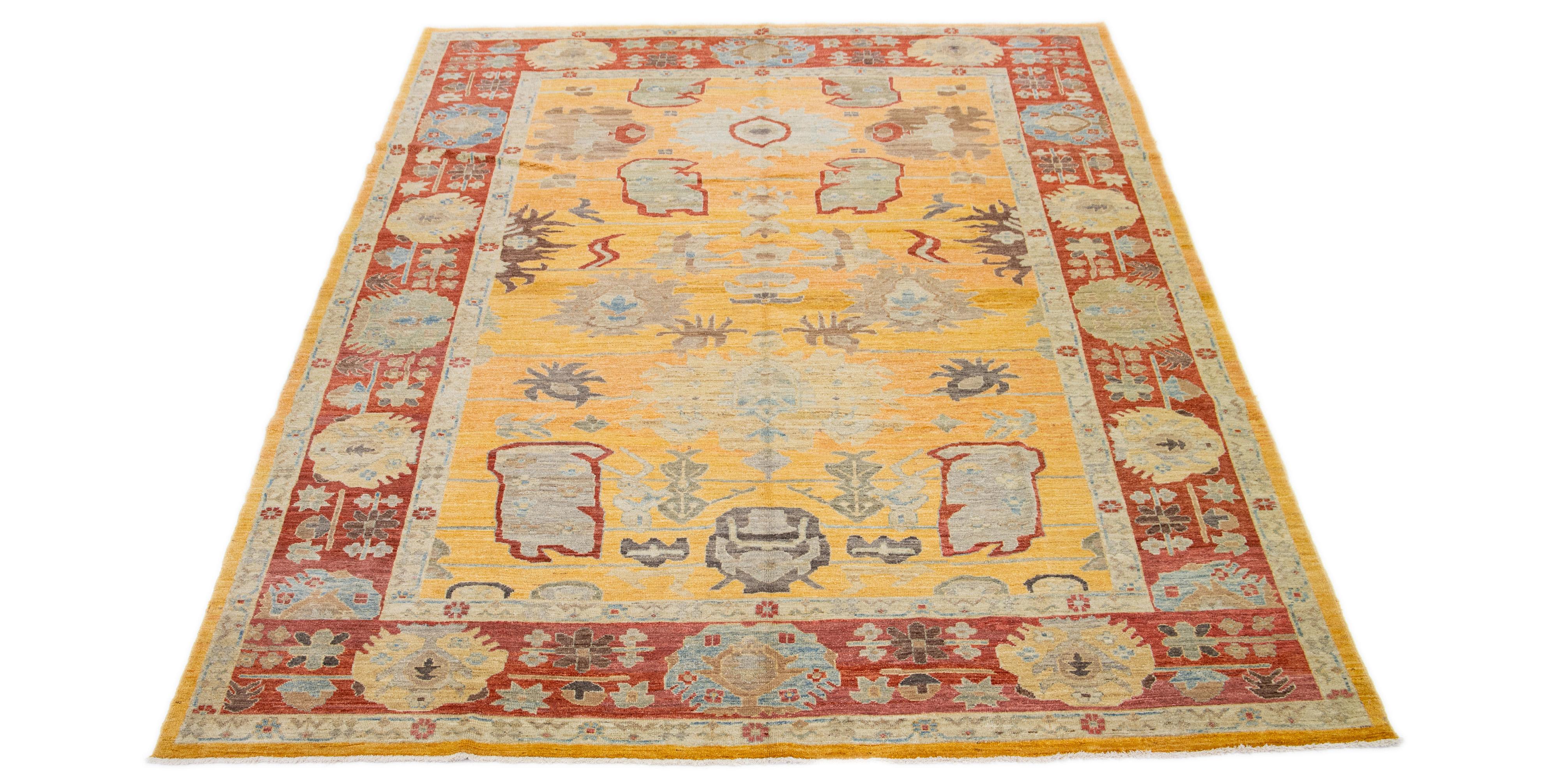 This stunning, hand-knotted Sultanabad rug showcases artisanal craftsmanship and aesthetic beauty. The rug features a captivating floral pattern overlaid on a geometric design set against a yellow backdrop. Its visual appeal is further enhanced by