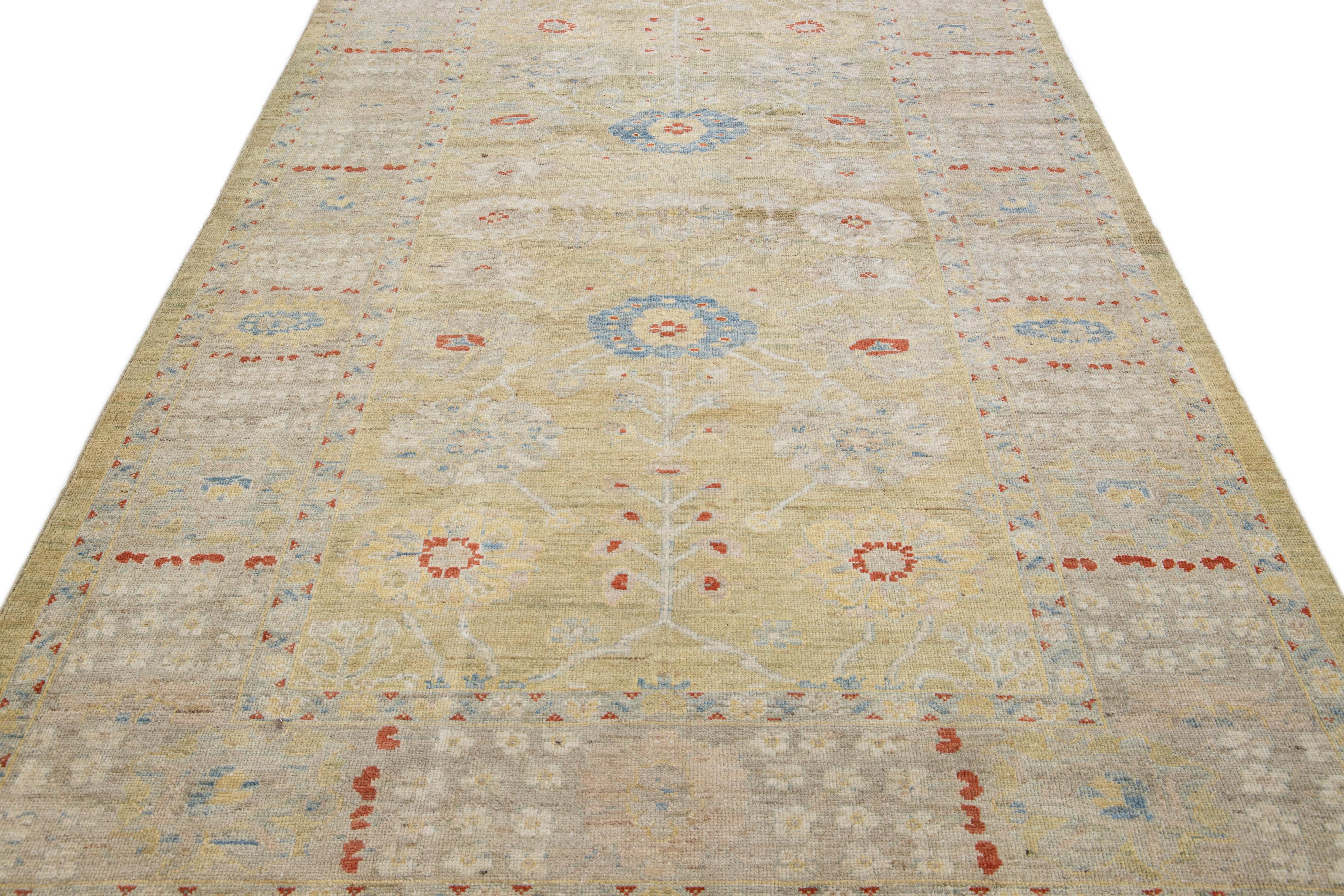 Beautiful modern Sultanabad hand-knotted wool rug with a yellow color field. This rug has a tan designed-frame with multicolor accents in a gorgeous all-over floral design.

This rug measures: 6'2
