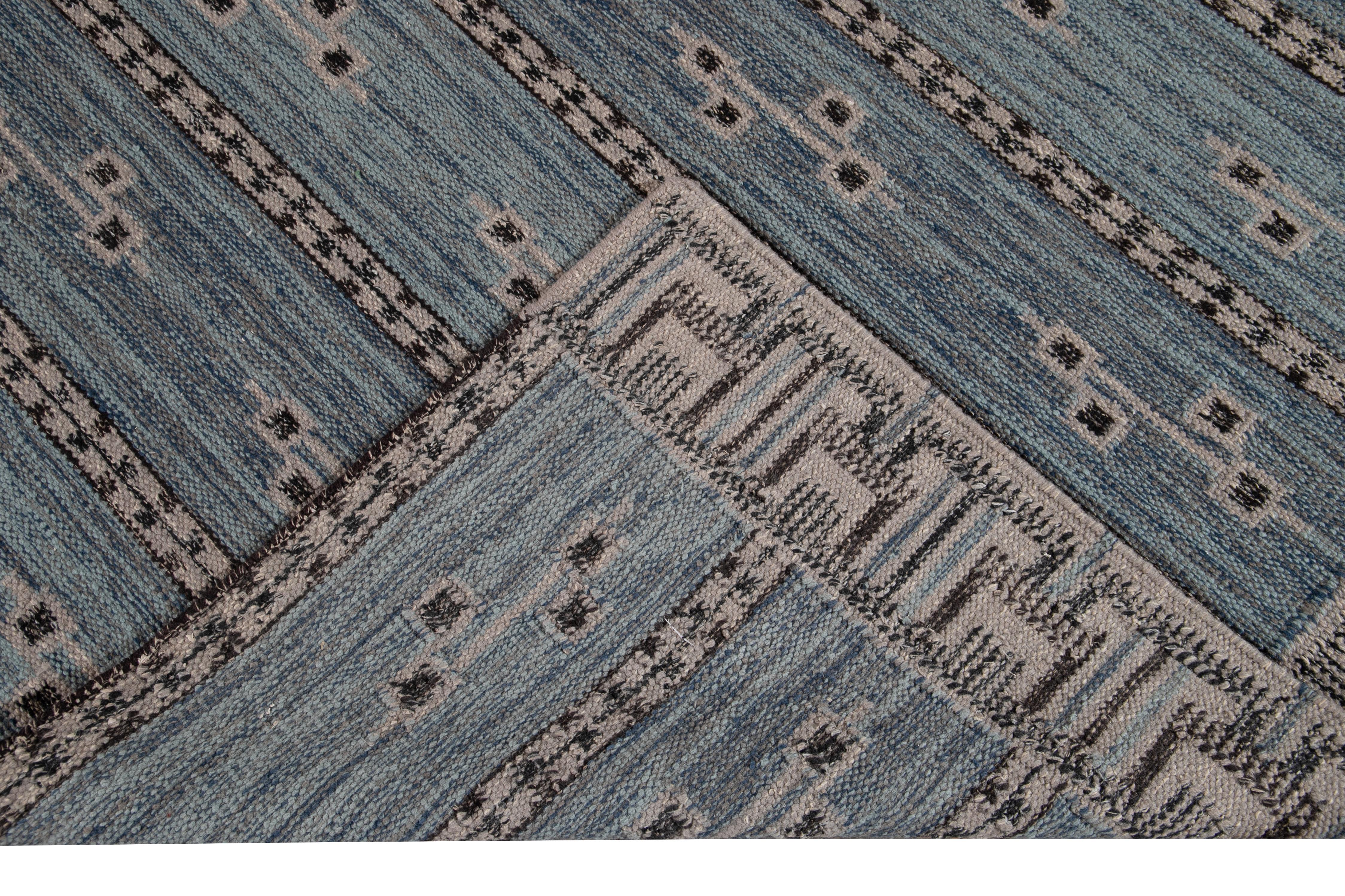 Beautiful modern oversize Swedish style wool rug with a navy-blue field. This Swedish rug has a black and gray accent in a gorgeous all-over geometric pattern design.

This rug measures: 12' x 16'3