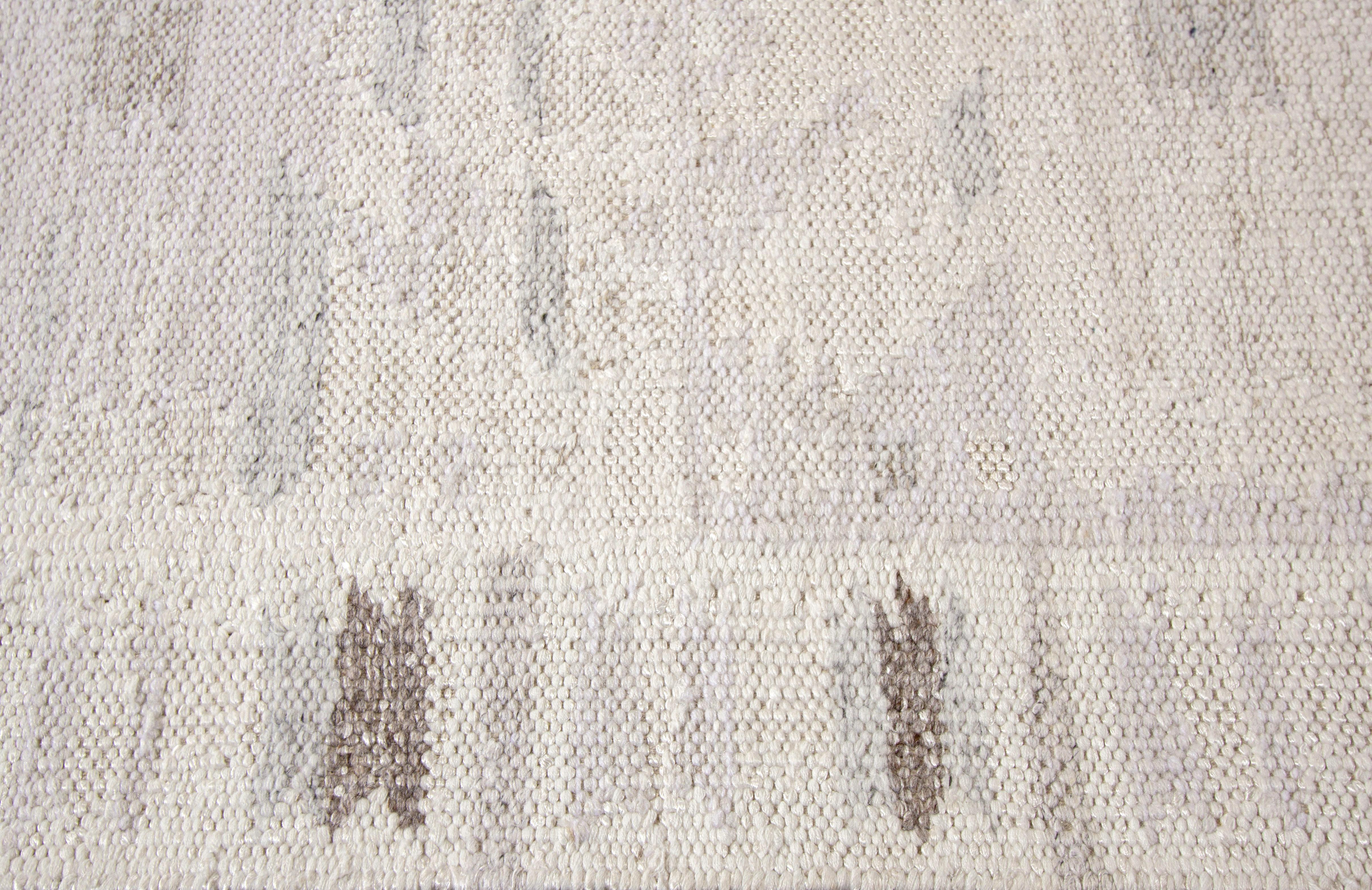 A modern Swedish style with an all-over white motif. This rug measures at 10' x 10'2