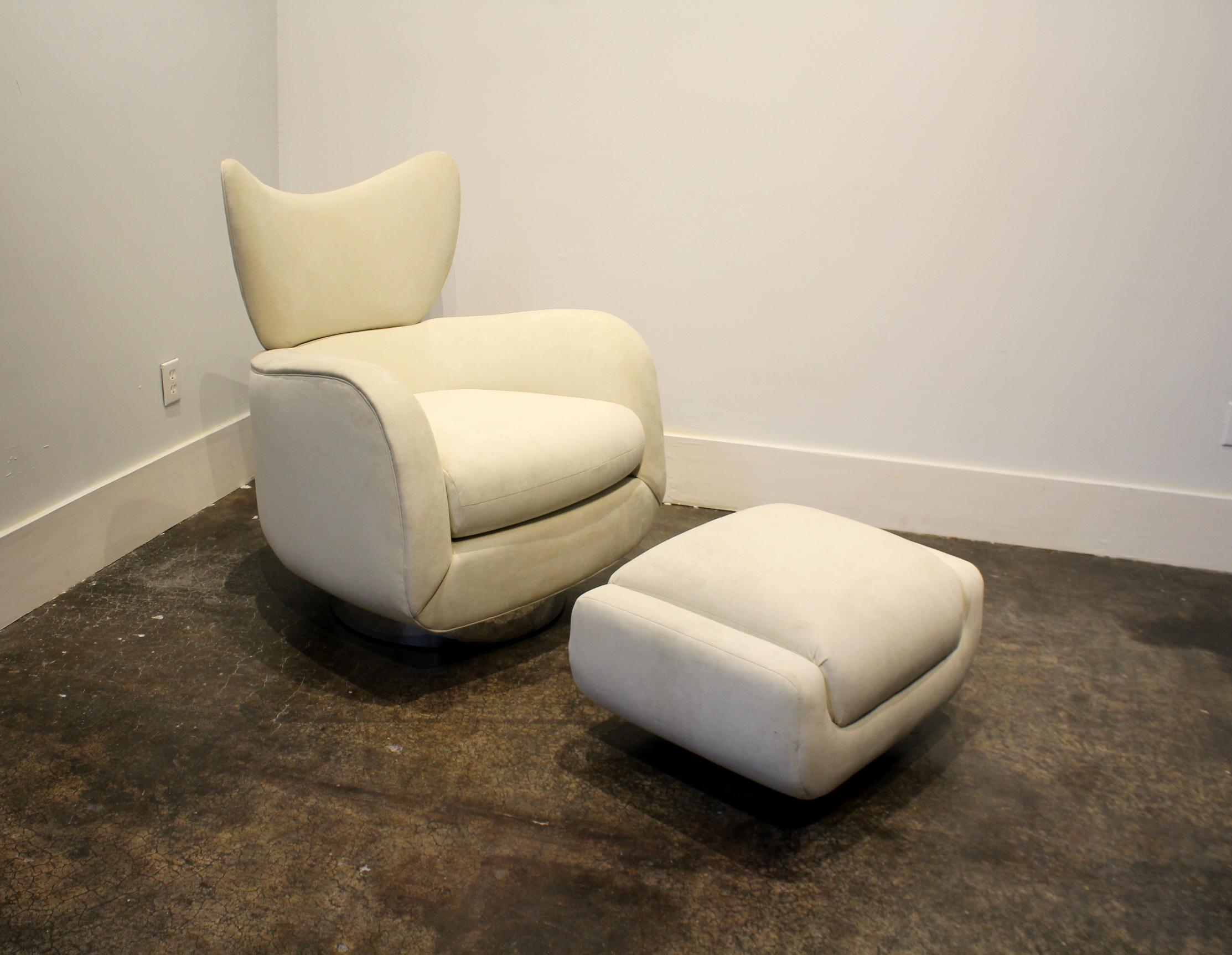 Stunning and rare design by Vladimir Kagan for Directional Furniture. Large, comfy and curvaceous wing-back lounge chair and ottoman in white Ultrasuede. Both raised on circular steel chrome base. In good condition, very minor signs of