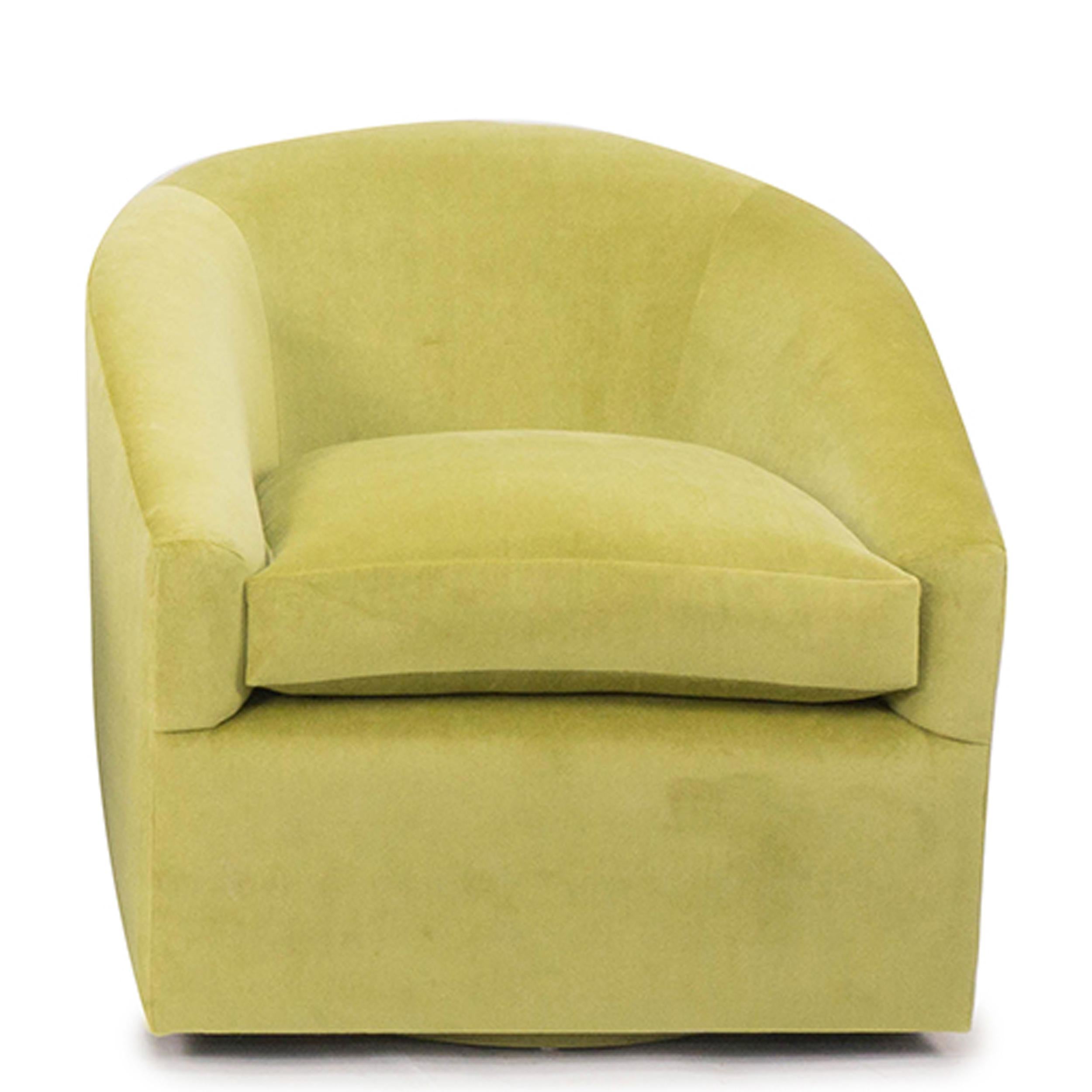 Our swivel chair is crafted out of solid hard maple with a firm back and a solid 8-way hand tied spring base. Covered in a lush lime green velvet, the gentle sloping arms and feather/down foam wrapped seat cushion gives excellent support & comfort.