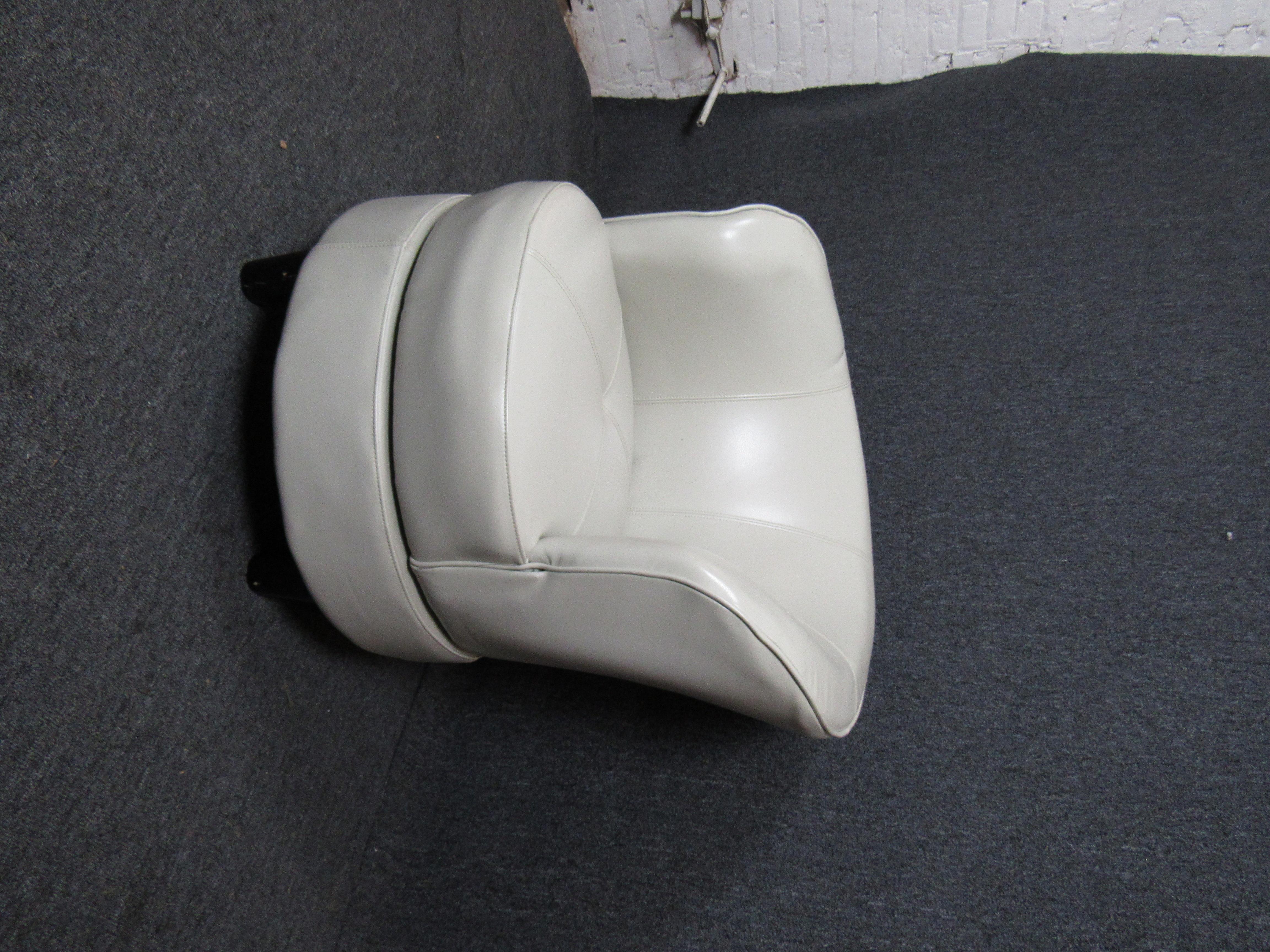 Gorgeous modern swivel chair covered in white vinyl fabric, this chair would make a great addition to any home or office.

(Please confirm item location - NY or NJ - with dealer)