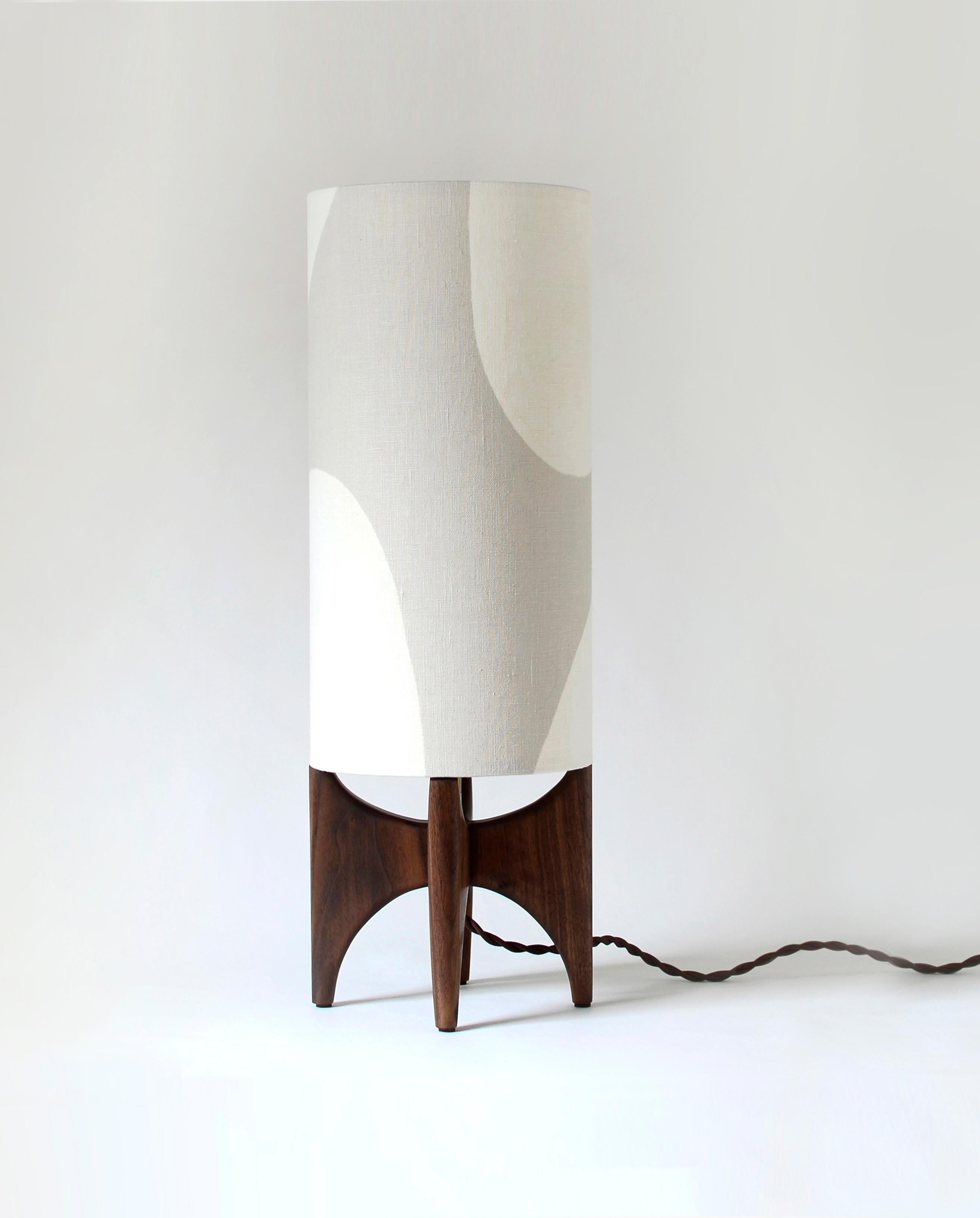 With a Modern style, this table lamp combines clean and curvilinear forms to create a unique piece. Our Luma Collection plays with simple shapes, exploring positive and negative space to create a unique and modern lampshade design, paired with a