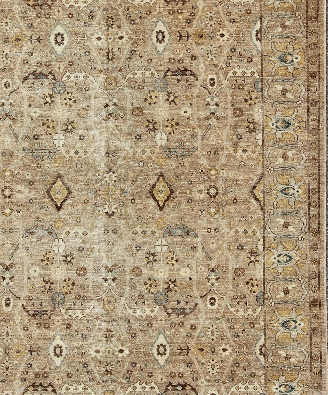 Measures: 9 x 11'10.
Tabriz Design rug with light camel background, Light Brown, tan, light brown, Lt. blue, yellow, and neutral color palette and all-over flower design. Modern Tabriz Design Rug in Camel Background by Keivan Woven Arts 