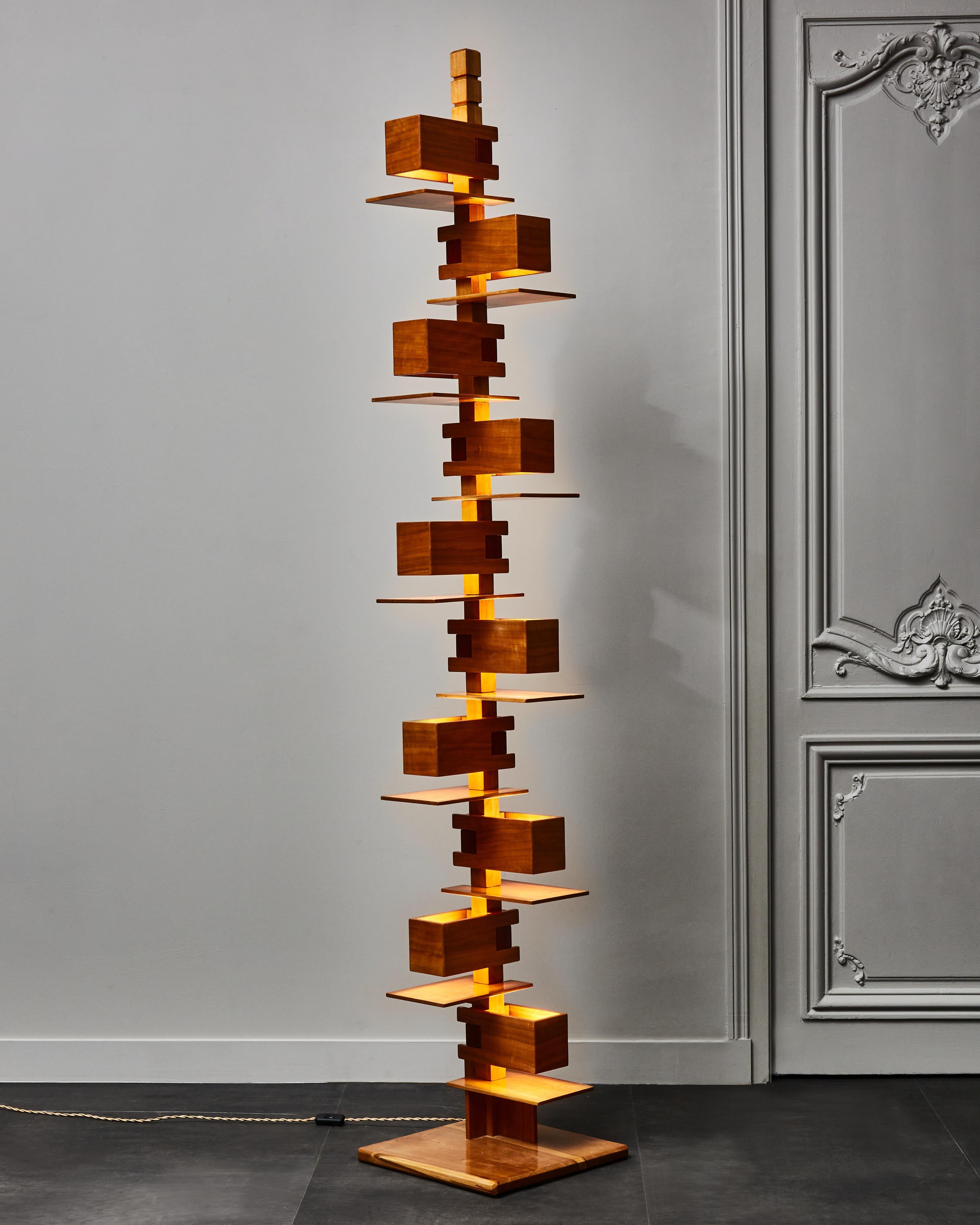 Tall cherrywood floor lamp designed by Franck Lloyd Wright and called Taliesin 2. Made of different shelves with integrated lights, each enlightening the one below.