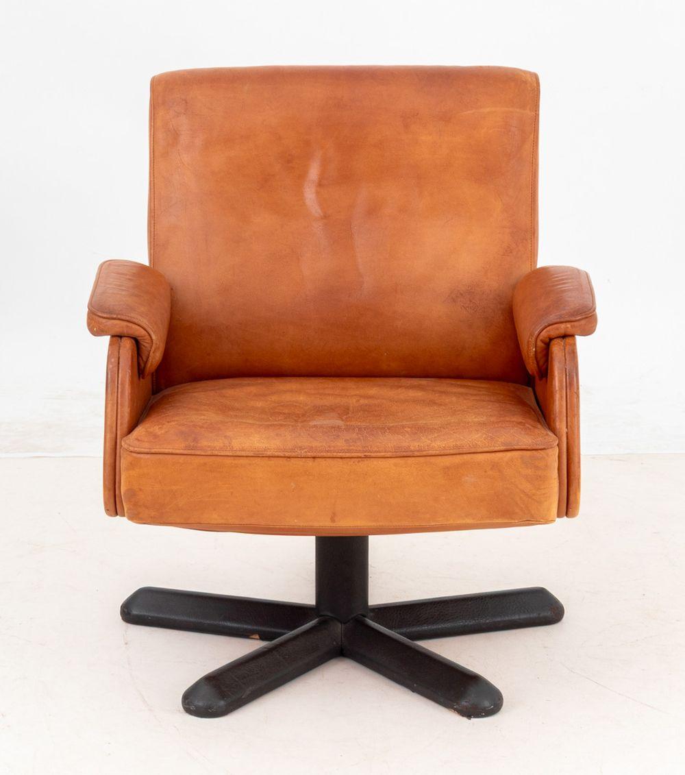 Modern Tan Leather Swivel Armchair, on four point star base. 31.5