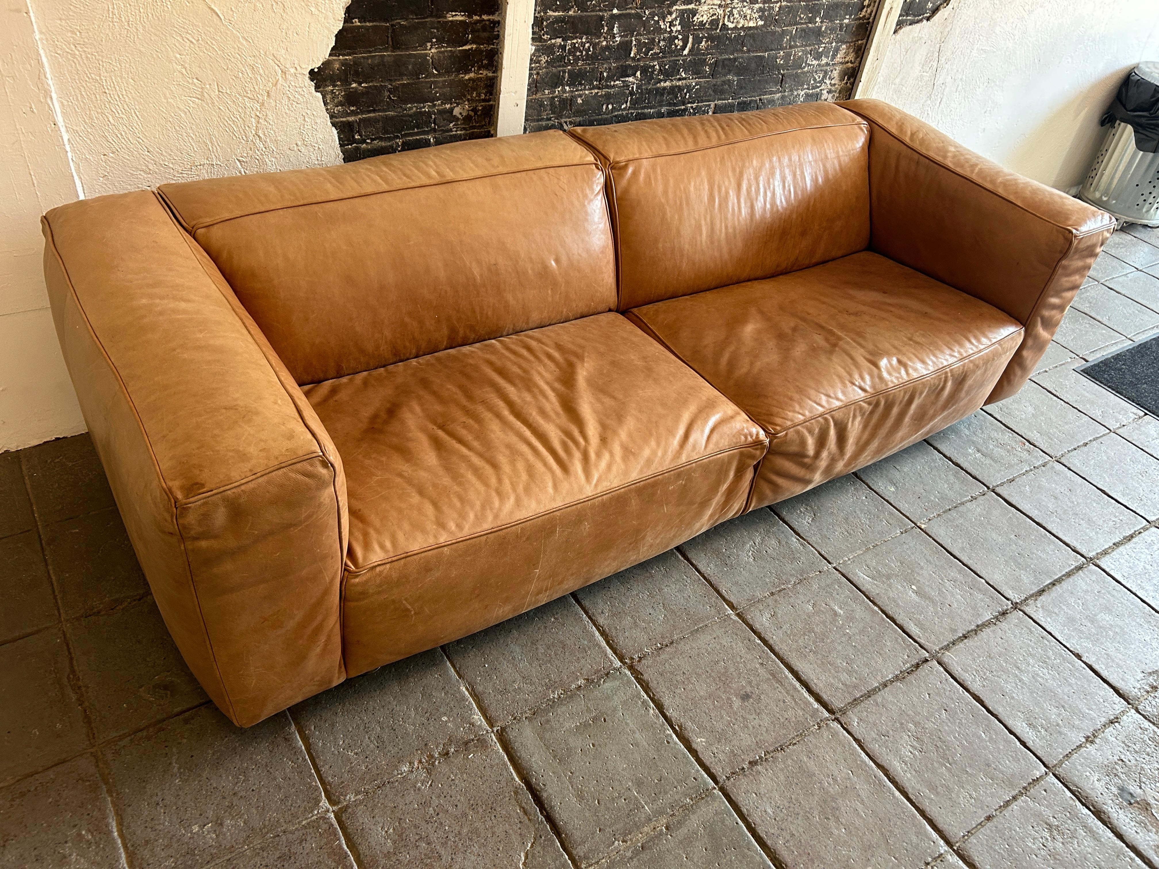 Italian Modern tan leather wide cube sofa on steel tube legs