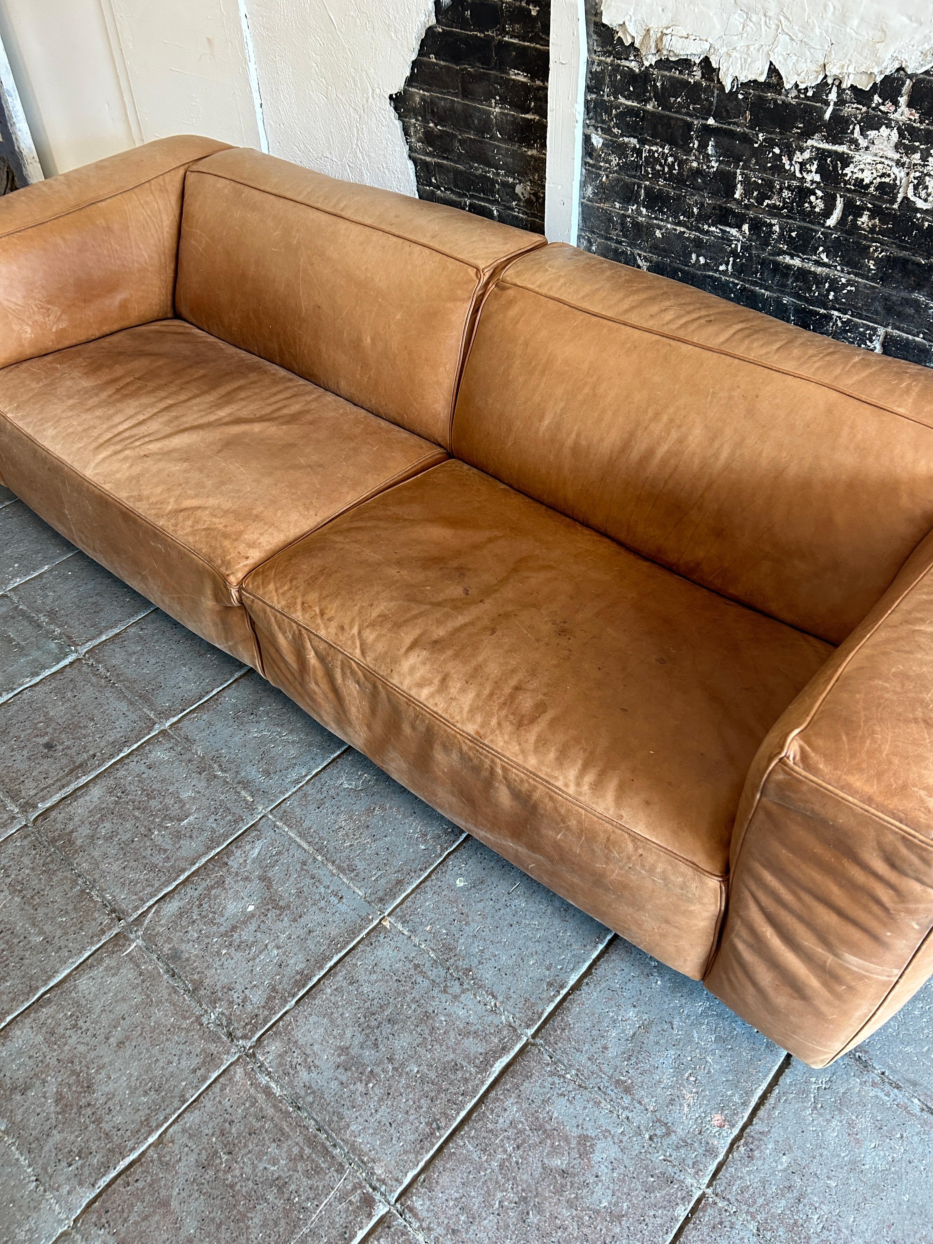 Contemporary Modern tan leather wide cube sofa on steel tube legs