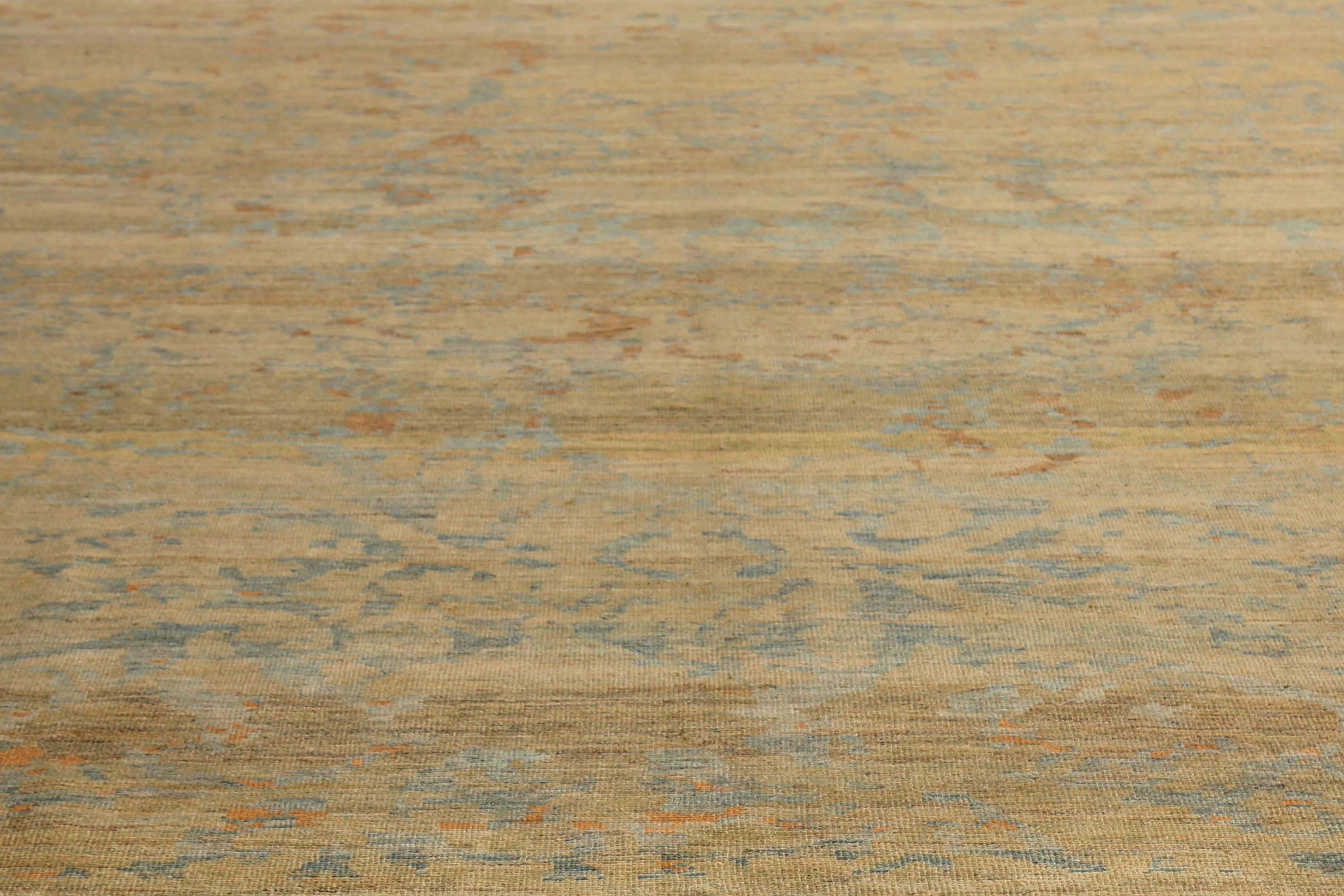 Introducing our beautiful handmade Turkish Sultanabad rug, sized at 9'6'' x 11'8''! With a light tan background and vibrant pops of orange, blue, and light blue in its modern design, this rug is sure to add a touch of elegance to any room. The