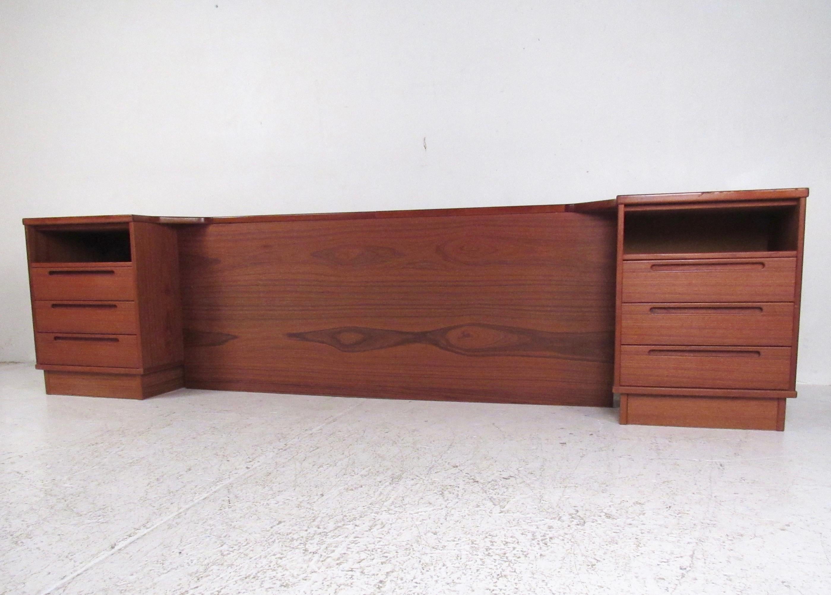 This unique Scandinavian Modern headboard features rich teak wood finish and comes with attached three-drawer nightstands. Plenty of storage space in each end table alongside the sixty-four inch opening for a queen-size bed. Impressive mid-century