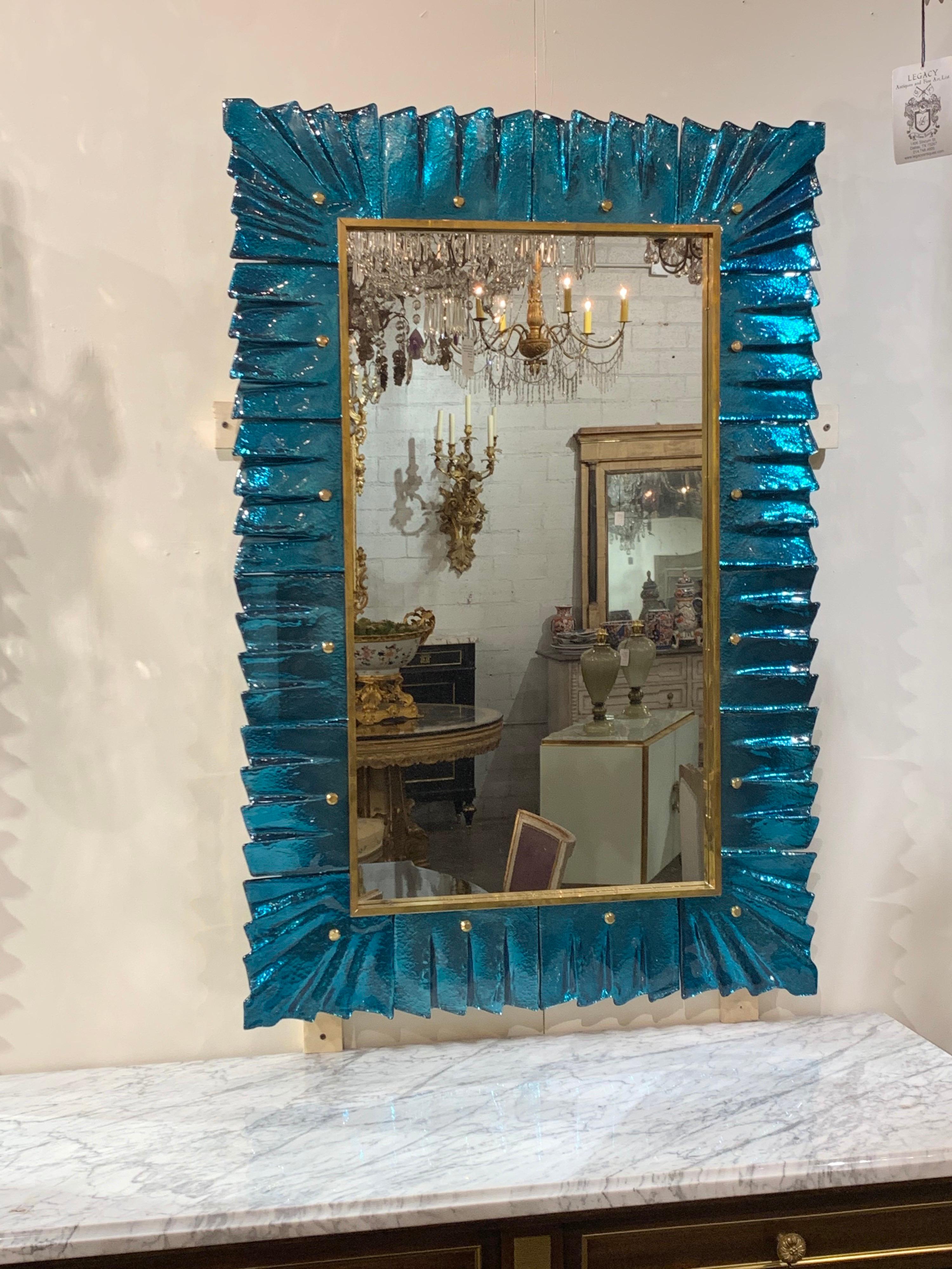 Fabulous modern teal colored Murano glass mirrors. The color and brilliance of these mirrors is spectacular!
Note: Price listed is per item.